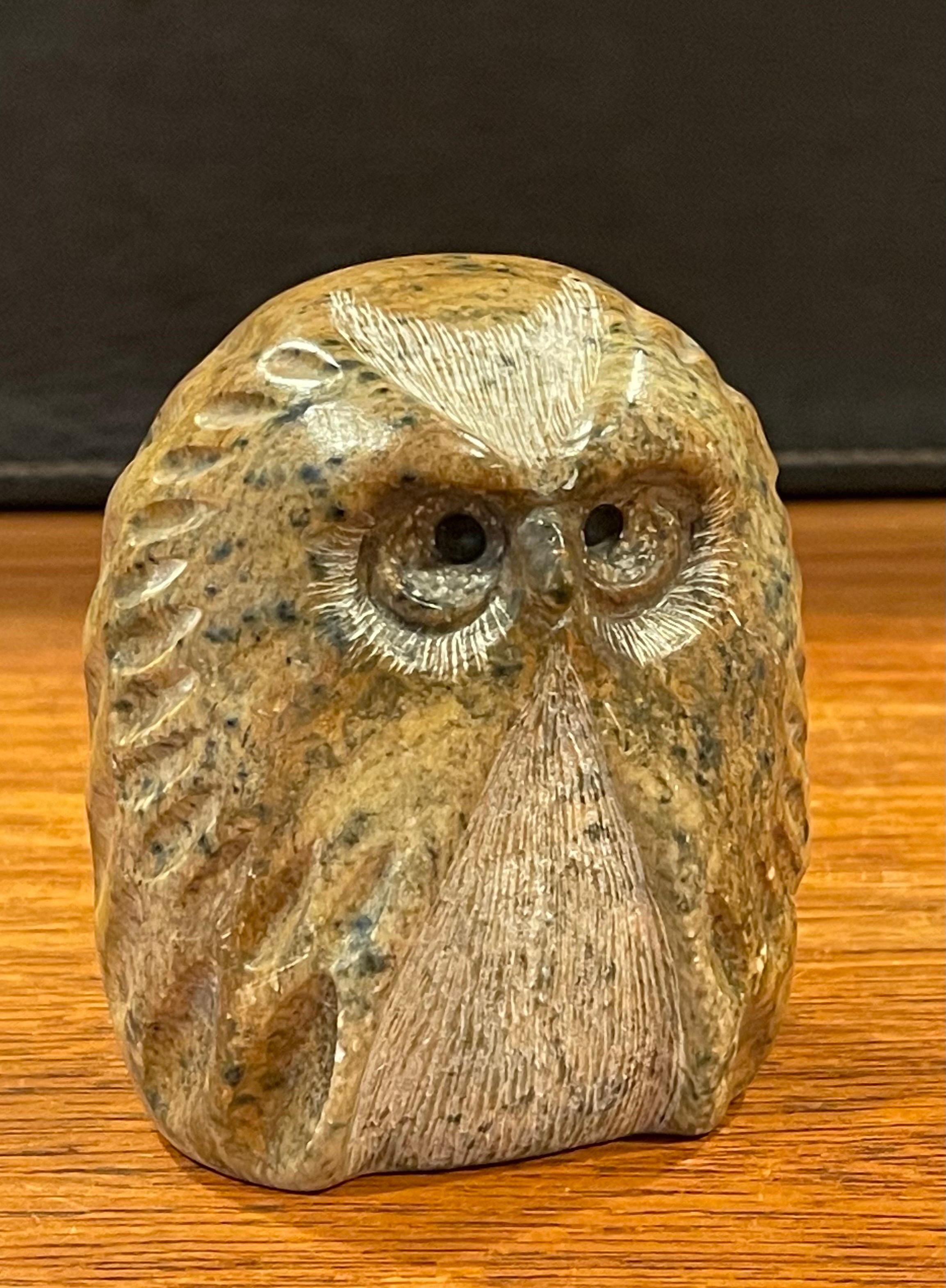Brutalist style carved soapstone owl sculpture by Glenn Heath, circa 1991. The owl is in very good vintage condition with no chips or cracks and measures 3