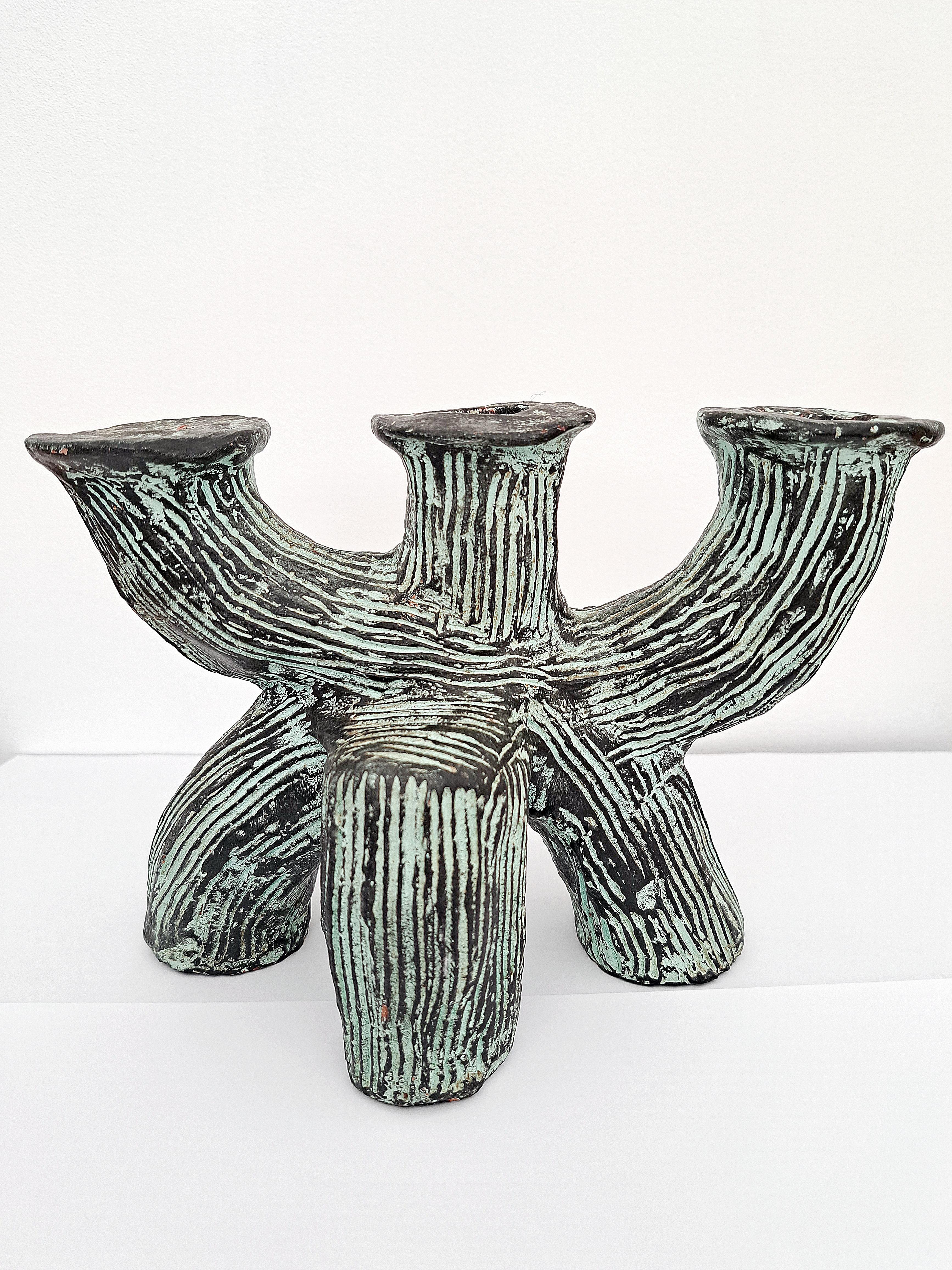 A rather unusual ceramic candelabra/candlestick with 3 arms. Resemble a trunk in a green and black glaze, organic form, designer unknown no mark. Good overall condition no cheap or repairs. France late 20th century.