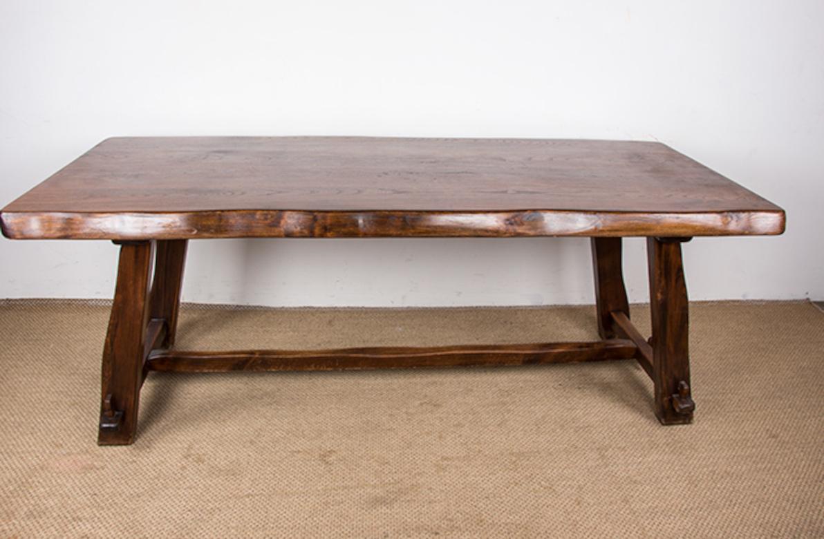 Stunning Scandinavian-style dining table. Entirely handmade, like a farmhouse table, this elegantly rustic table comfortably seats eight. A large central stretcher and side stretchers held by tenons provide excellent stability. Clean design,