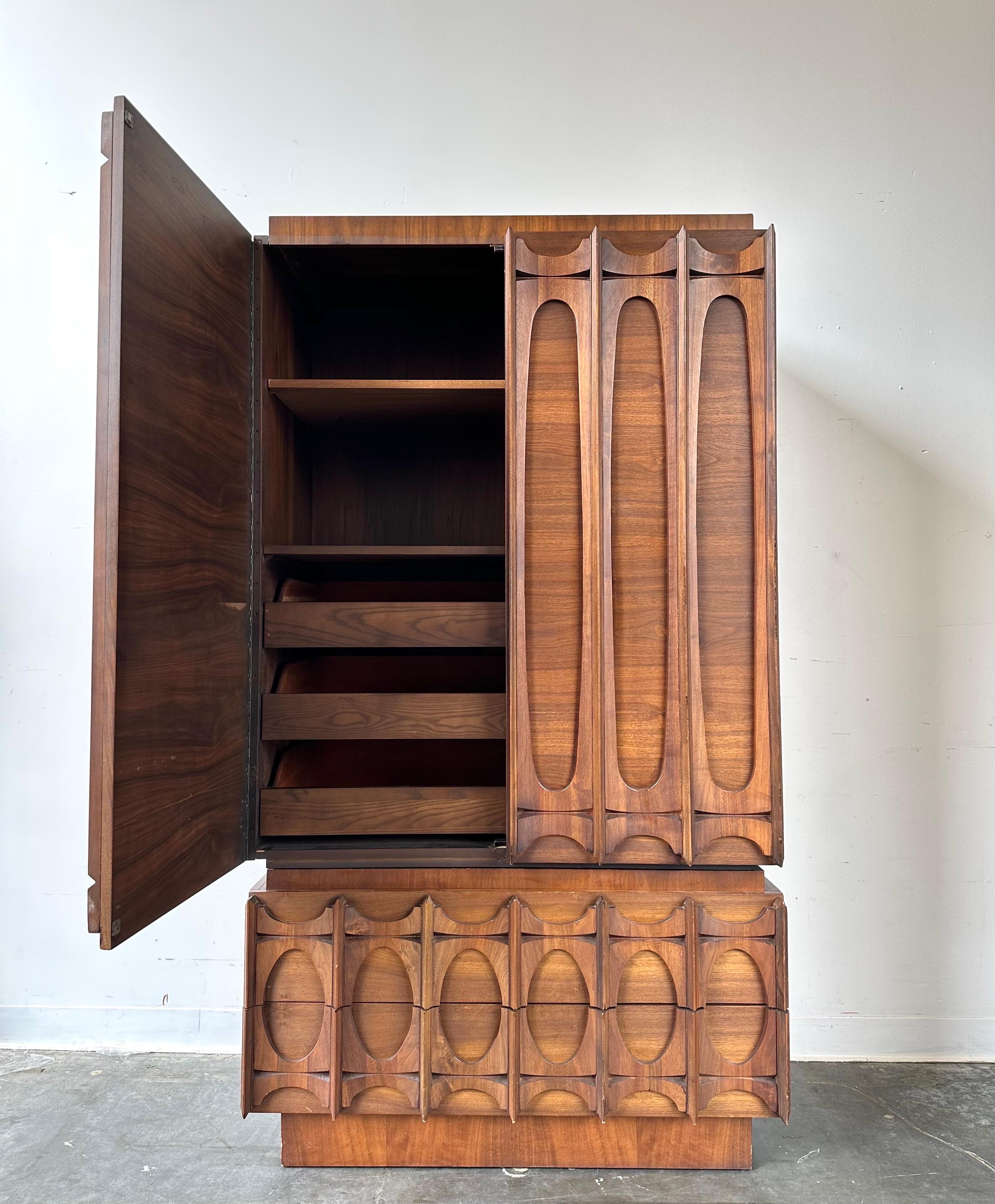 Brutalist style vintage Highboy.

Stunning piece from the Tabago series out of Canada. Dark walnut with minor wear (light chips) This unit breaks down into two pieces for easy transport.
 