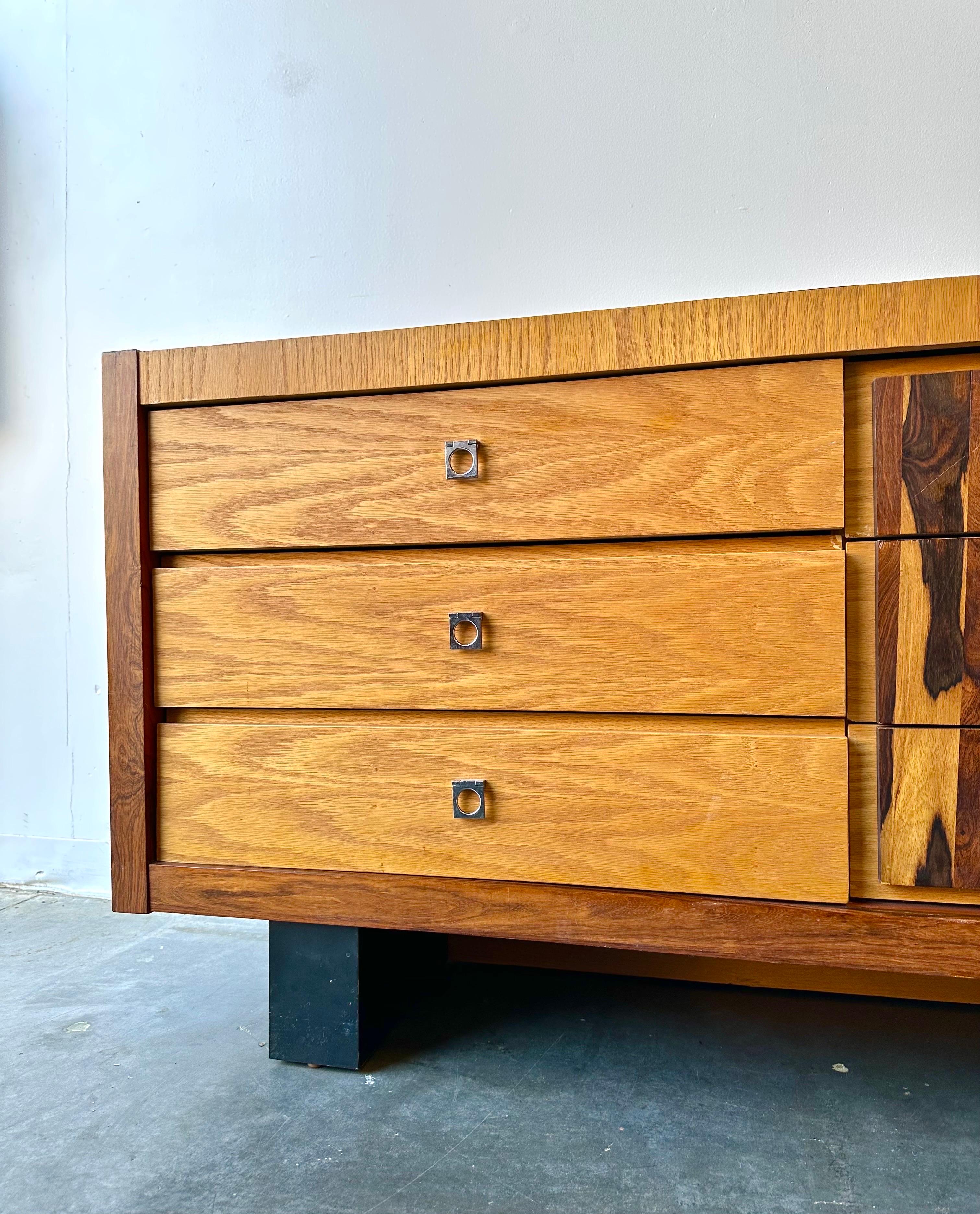 Vintage 1970s rosewood and oak lowboy nine drawer dresser or the perfect credenza.

This piece was made in Canada circa 1970 and is in great vintage condition with minor signs of wear.

Dimensions:
79.5” W x 20.25” D x 30” H 