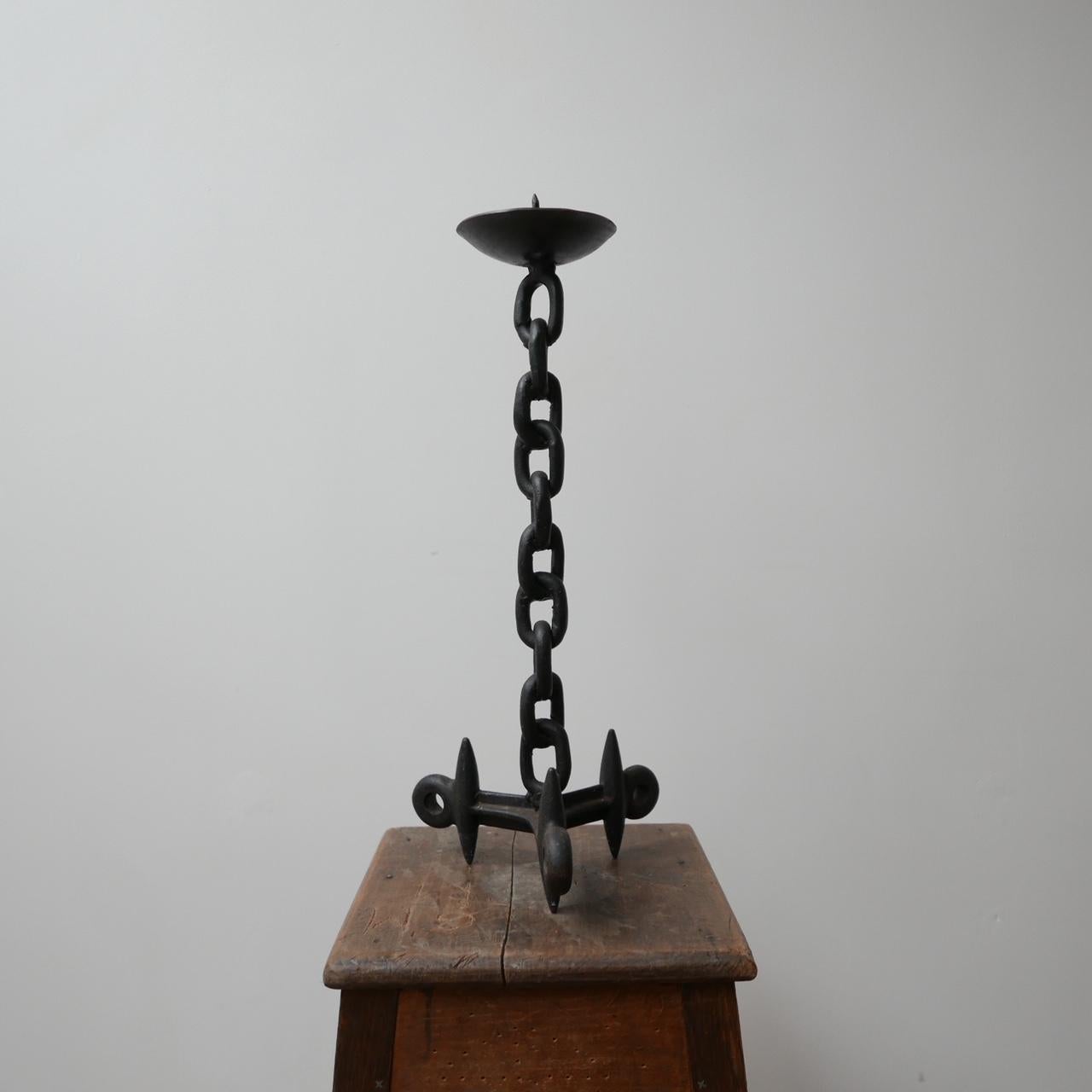 A large metal candlestick, blacksmith made in the form of a chain.

Well-formed and stylish.

Brutalist, Belgium, circa 1970s.

Dimensions: 51 height x 21 diameter in cm.
  