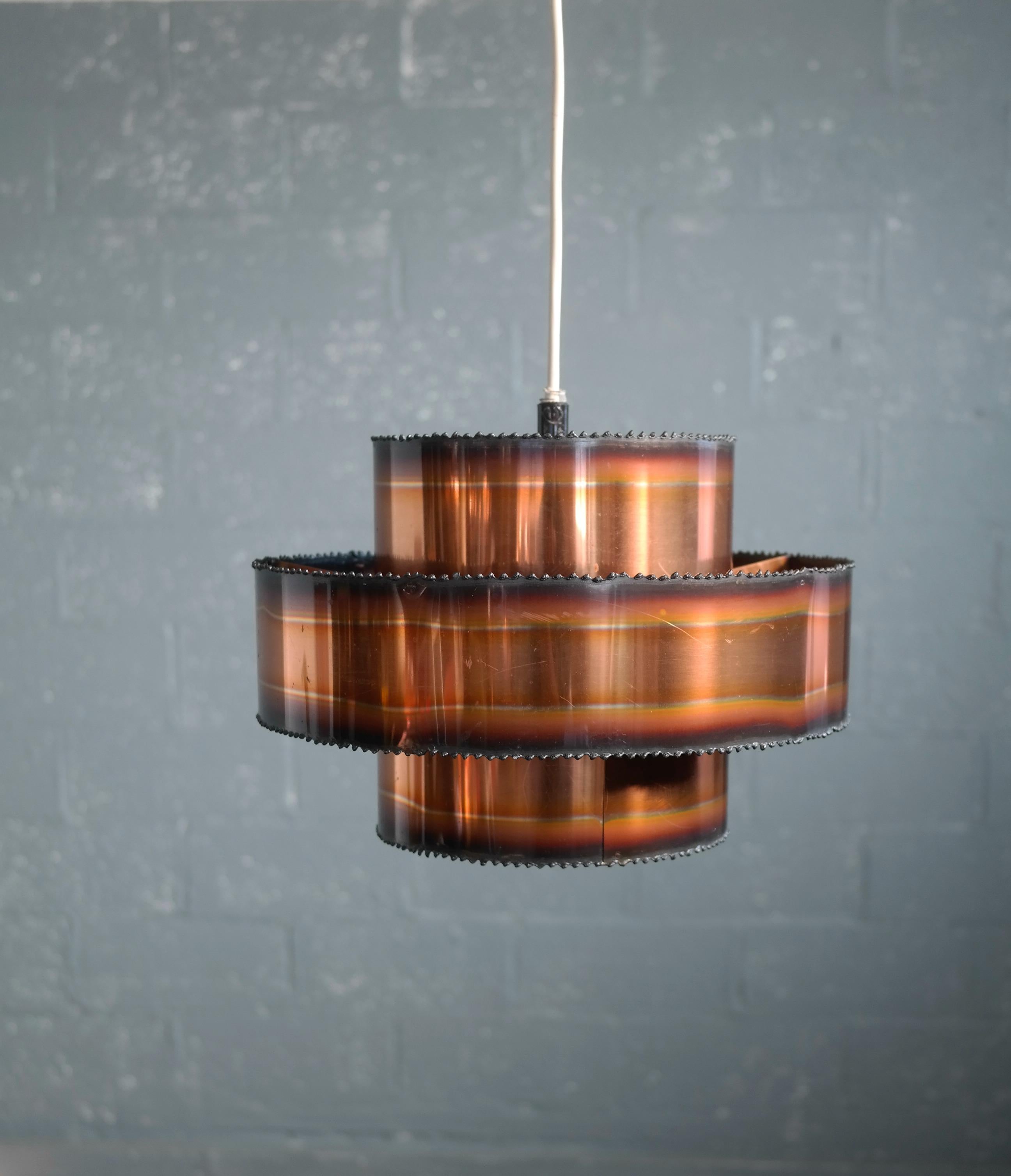 Iconic Brutalist Svend Aage Holm designed pendant lamp made from blow torched patinated copper 
manufactured by Holm Sørensen & Co in Copenhagen in the 1960s. Overall excellent vintage condition with negligible age wear.
 