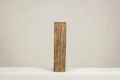 Brutalist-style stoneware vase with plant decoration. Dated 1977.