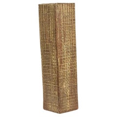 Brutalist-style stoneware vase with plant decoration. Dated 1977.