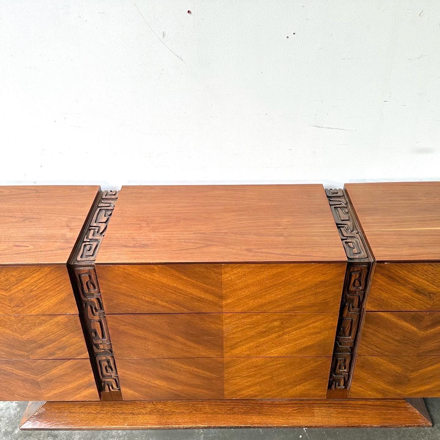 A handsome nine drawer dresser or credenza by united.

Brutalist inspired with tiki tones in the manner of Paul Evans or witco.

Great condition with minor signs of wear and a refinished top.