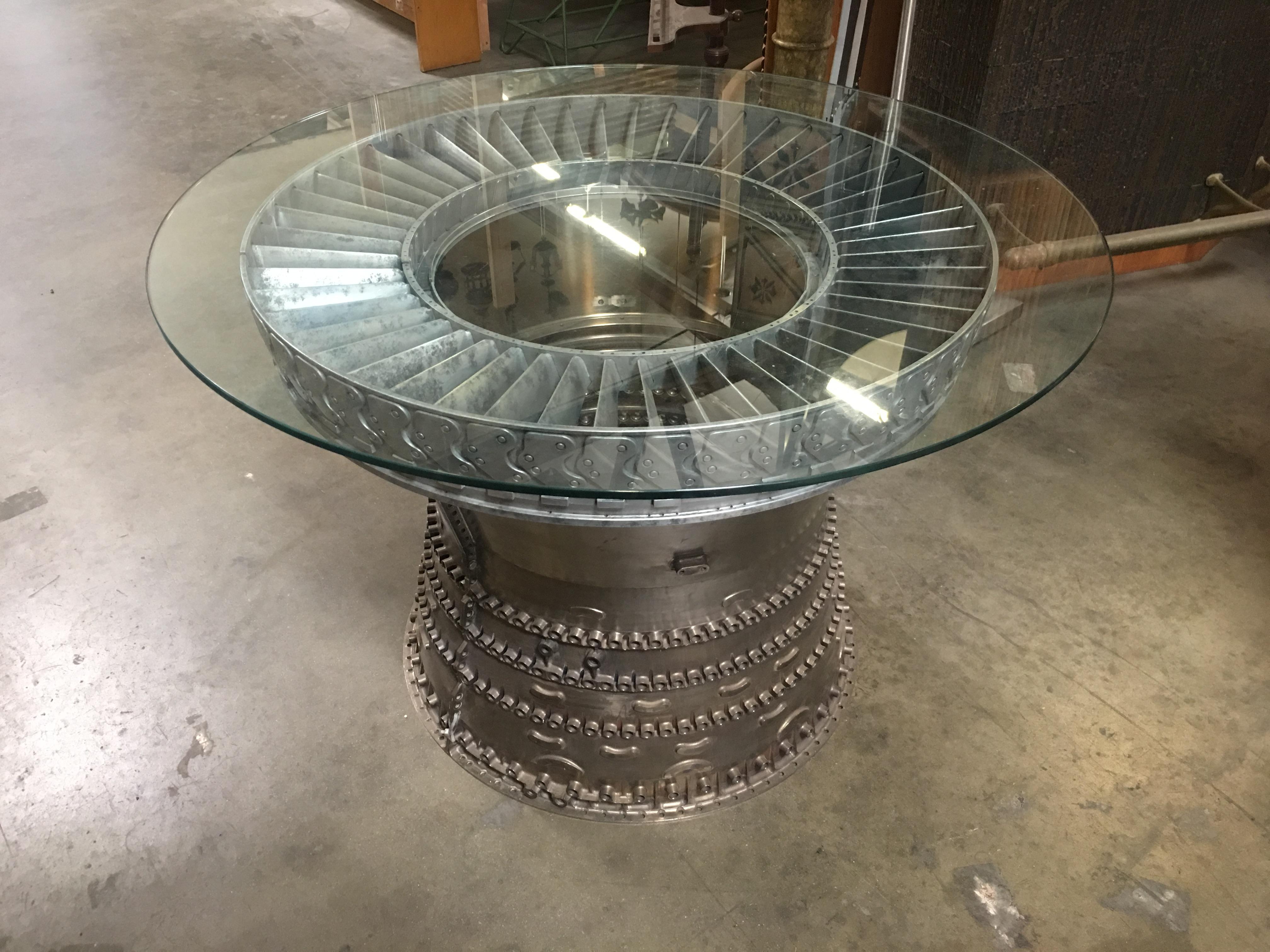 Unique Brutalist style jet turbine dining table featuring the titanium Venturi casing from jet engine with a 36