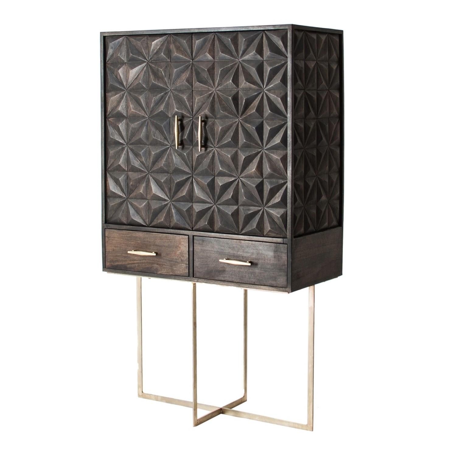 Brutalist dry bar cabinet in wood. An eyecatcher with geometrical and harmonious lines, this cabinet is composed of 2 large graphic door panels opening on storage compartments and 2 drawers, adorned with gilded metal feet.