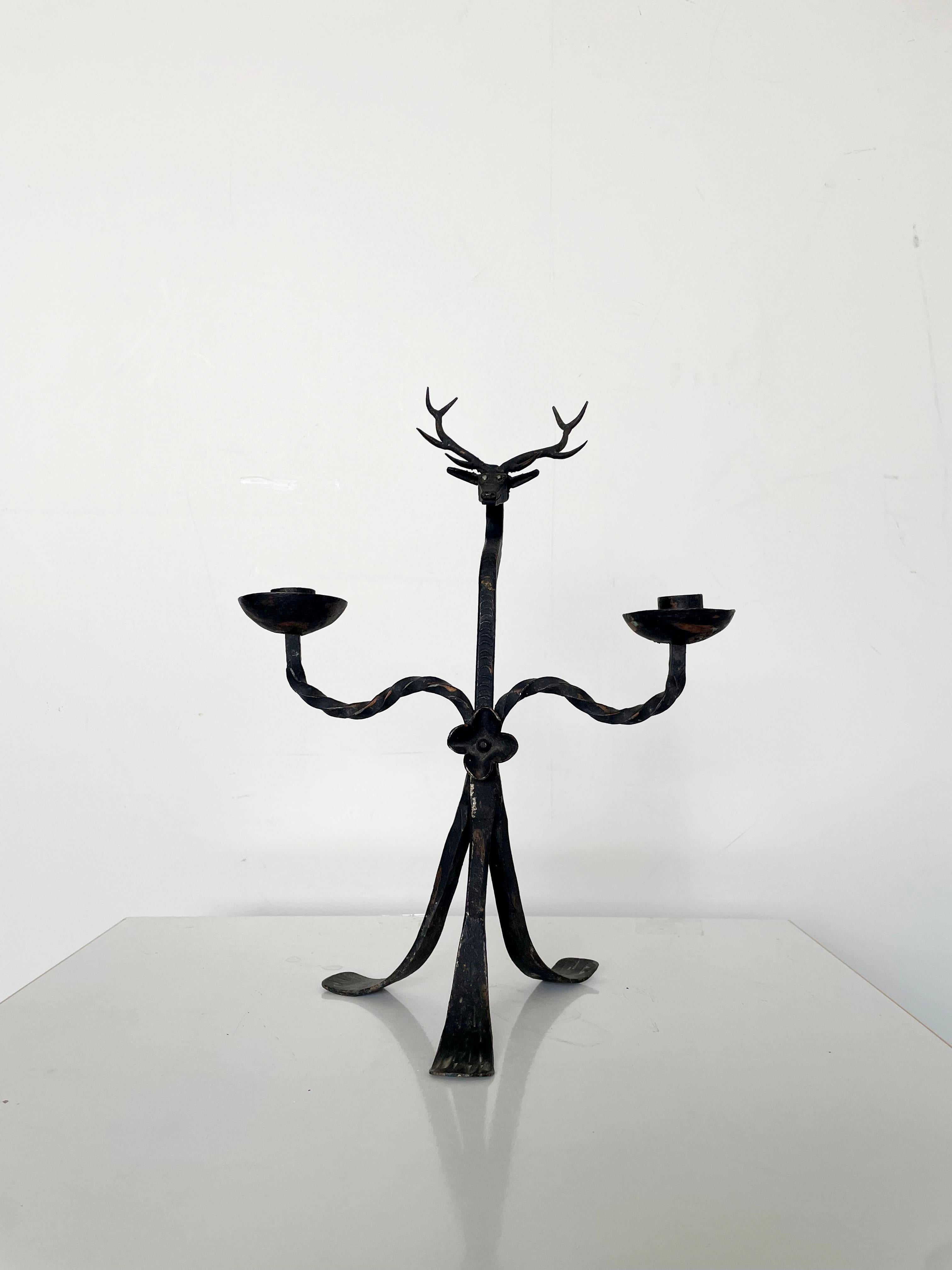 Vintage wrought Iron Deer Candlestick Candelabra designed in Brutalist style

Handcrafted in 1940s / 1950s

Dimensions: 36 x 28 x 18 cm (H x W x D); Suitable for 2 cm diameter candles

The item is in original condition and has some age and use