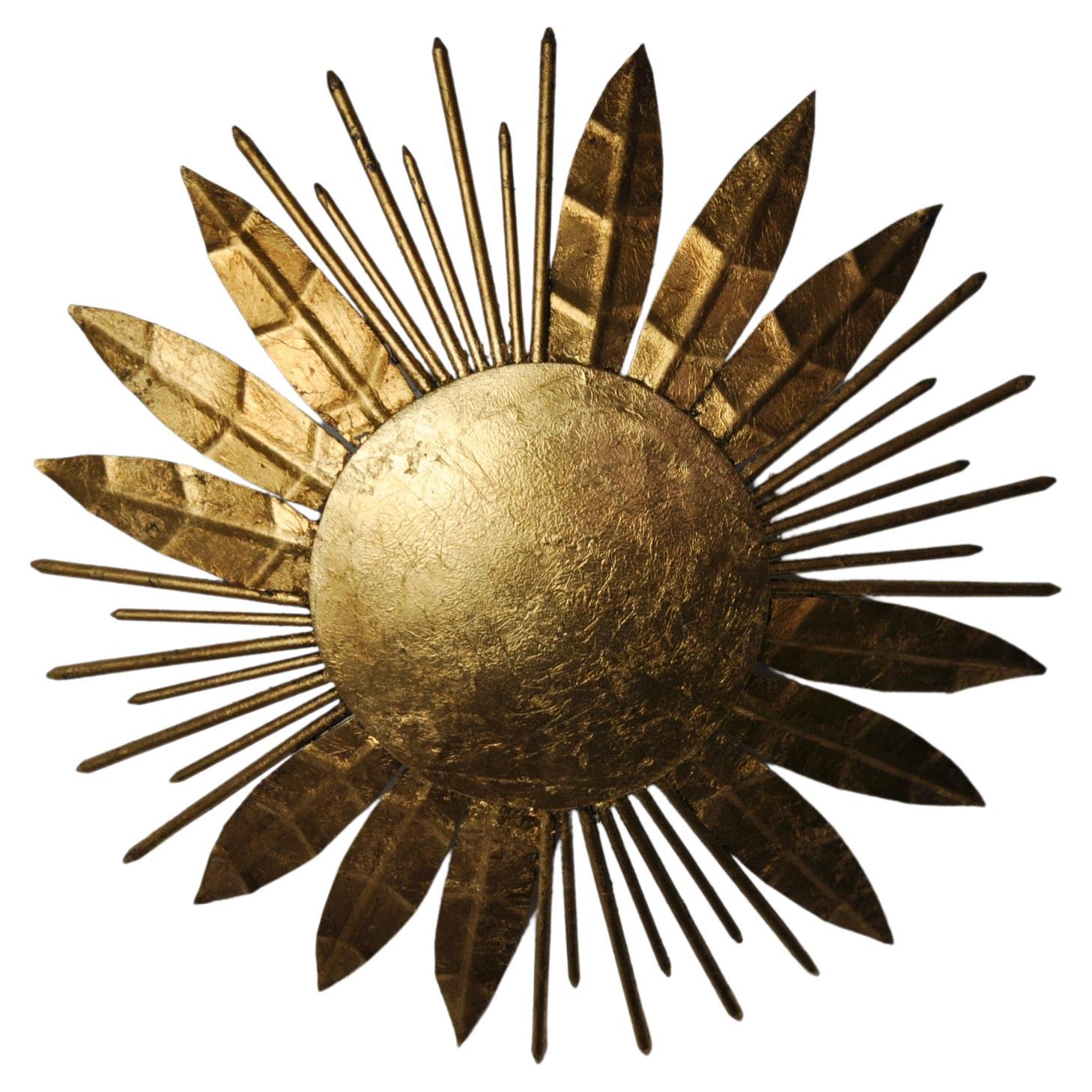 Brutalist sun floral wall lamp, gold leaf gilded metal, Italy, 1970 For Sale