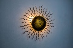 Brutalist sun wall light, gold leaf gilded metal, Italy, 1970