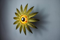 Brutalist sun wall light in gold leaf gilded metal, Italy, 1970