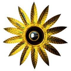 Brutalist sun wall light in gold leaf gilded metal, Italy, 1970