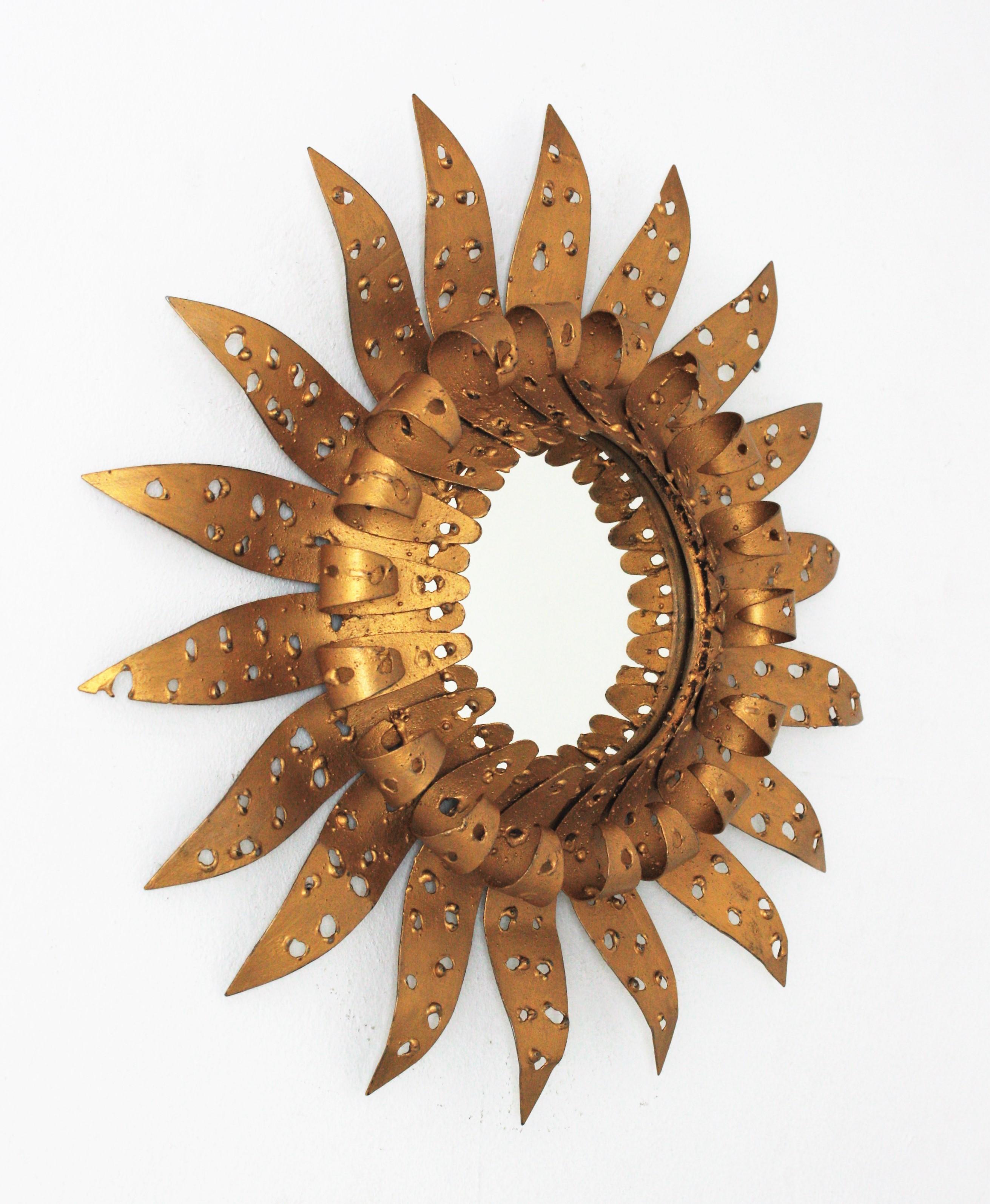 French Sunburst Eyelash Perforated Brutalist Mirror in Gilt Iron, 1960s For Sale