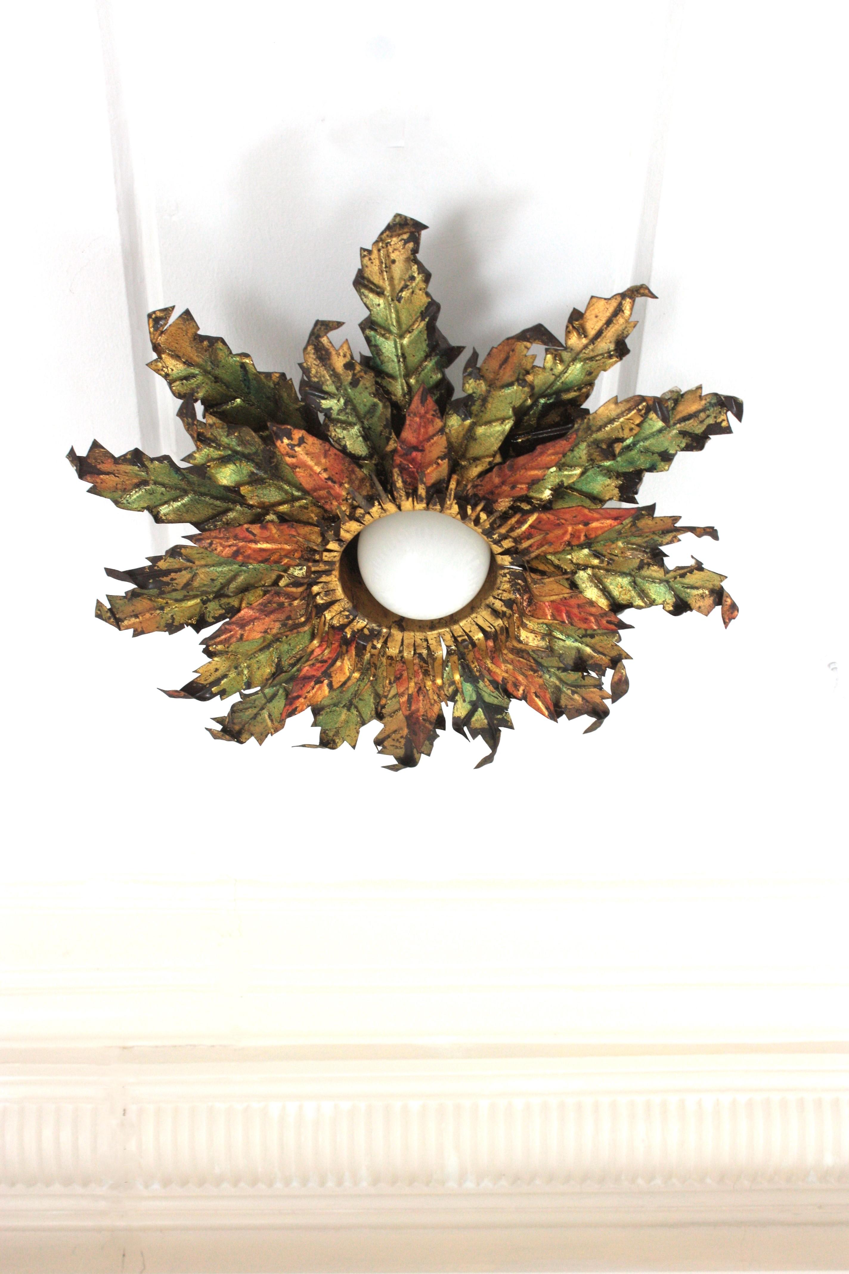 Spanish Brutalist Sunburst Foliage Light Fixture in Gilt Iron with Green & Red Accents For Sale