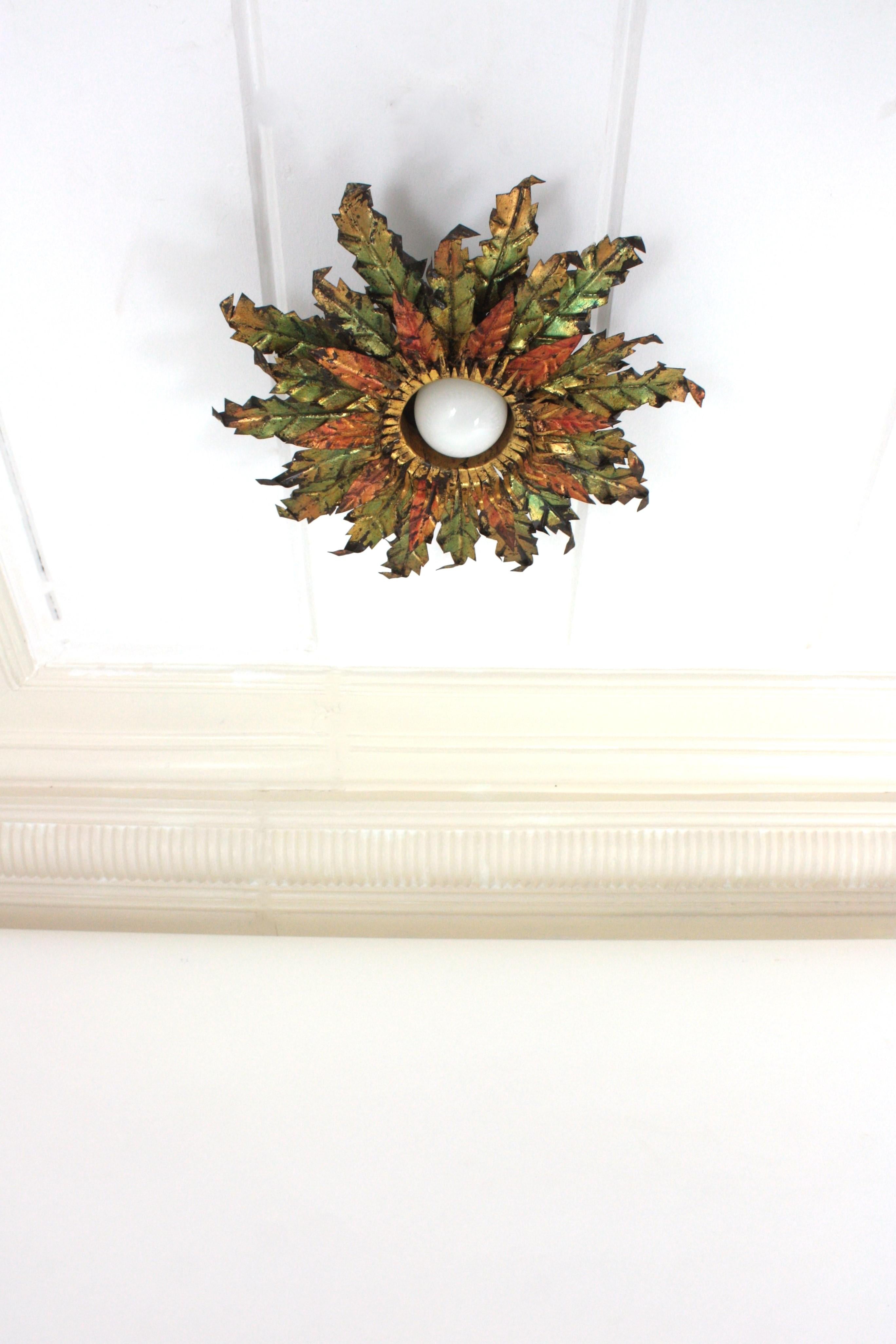 Brutalist Sunburst Foliage Light Fixture in Gilt Iron with Green & Red Accents In Good Condition For Sale In Barcelona, ES