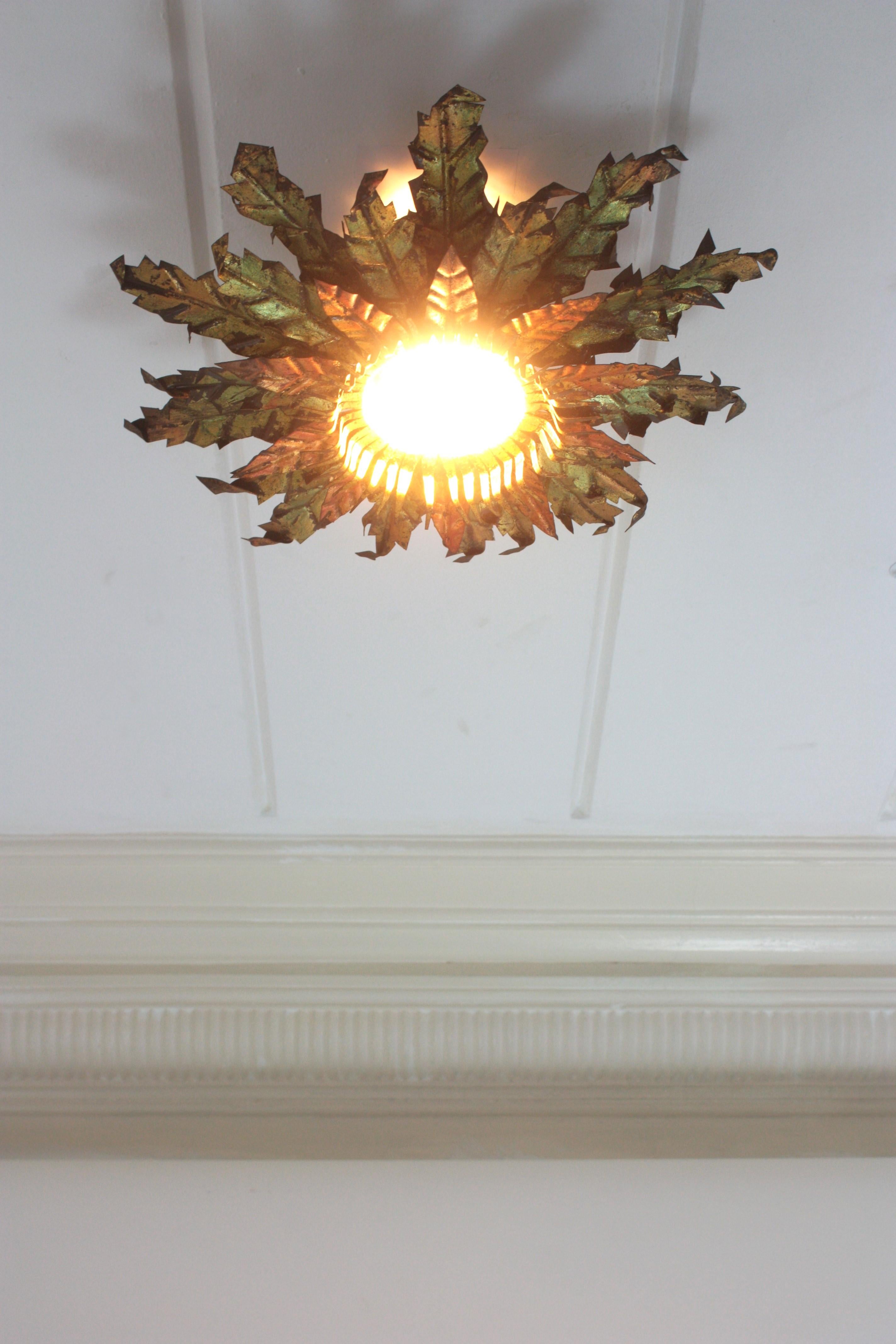 Metal Brutalist Sunburst Foliage Light Fixture in Gilt Iron with Green & Red Accents For Sale