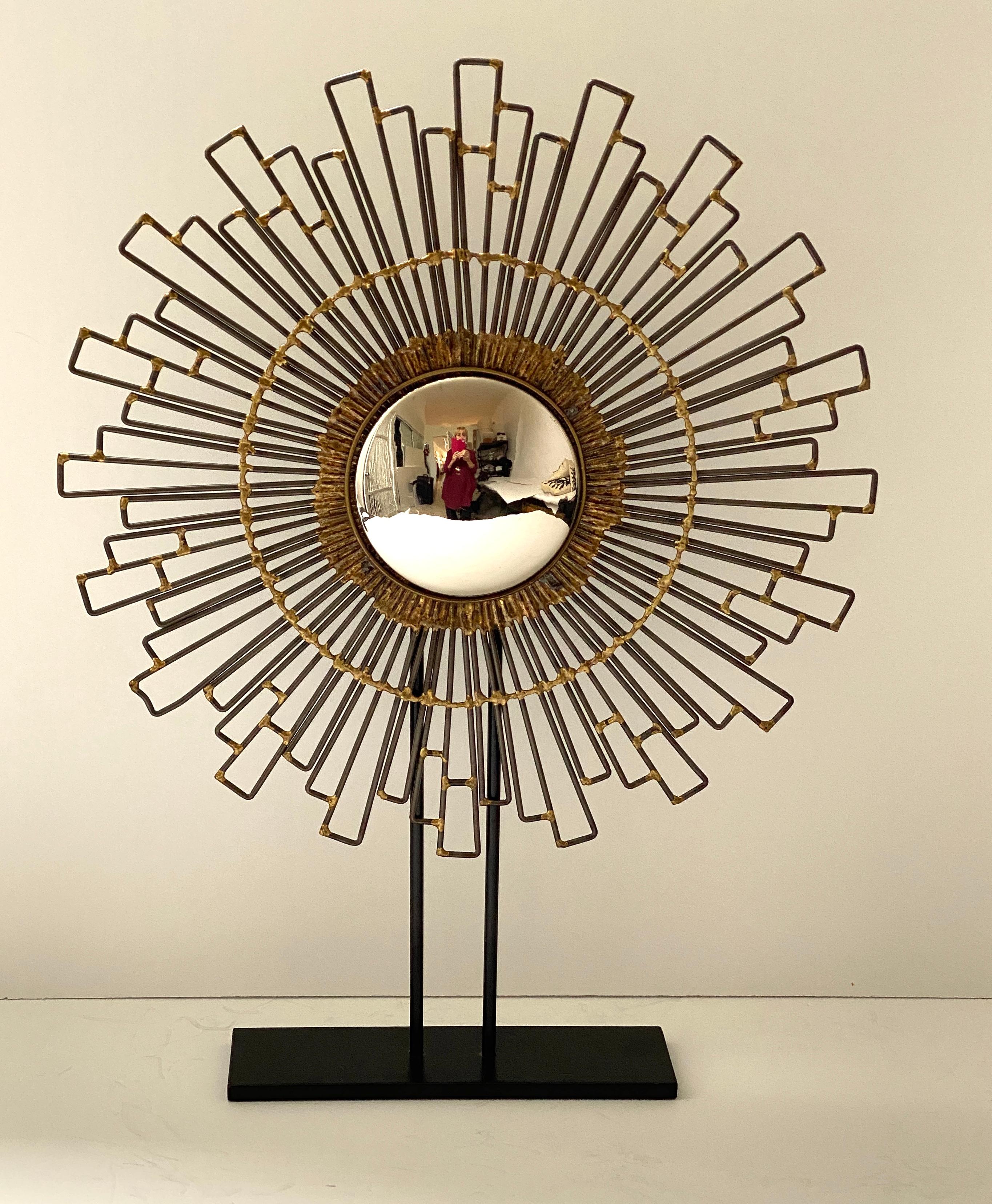 This chic brutalist, convex mirror on stand is very much in the style of pieces created during the mid-century. 

Note: Convex mirror measures 5