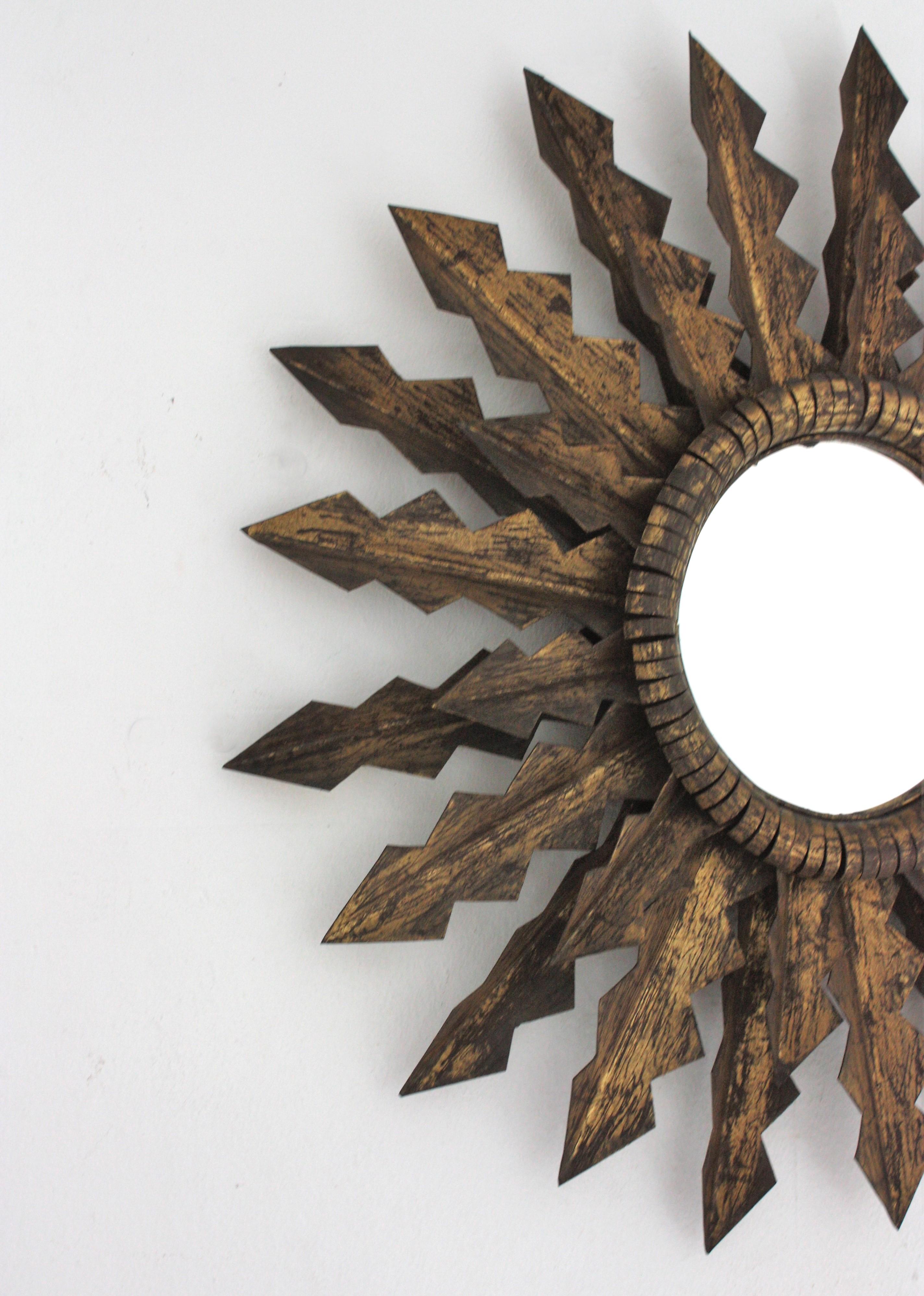 French Brutalist Sunburst Mirror with Double Layered Jagged Frame in Gilt Wrought Iron For Sale