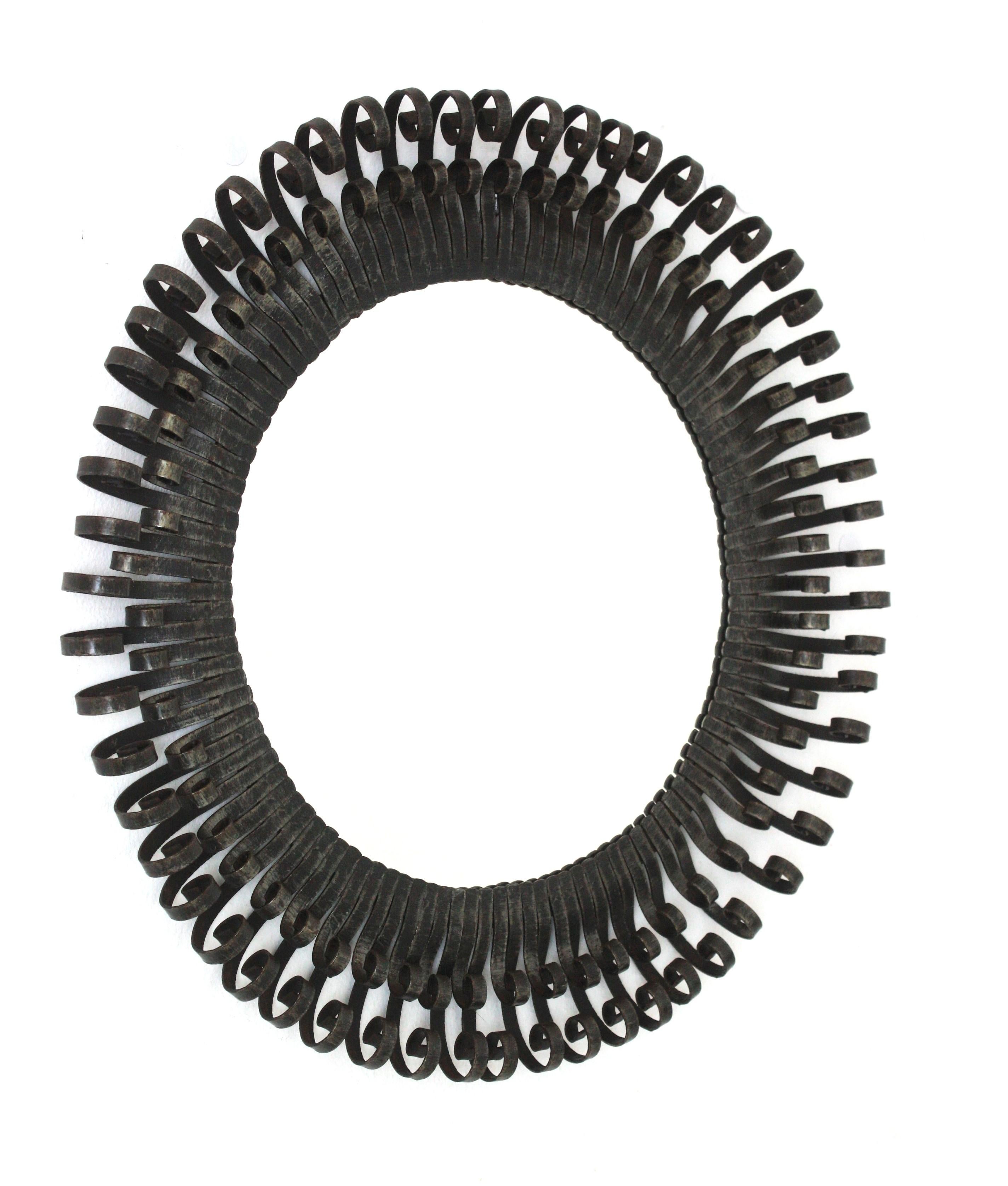 Brutalist Sunburst Mirror with Scroll Endings, Wrought Iron, 1950s Martillado en venta