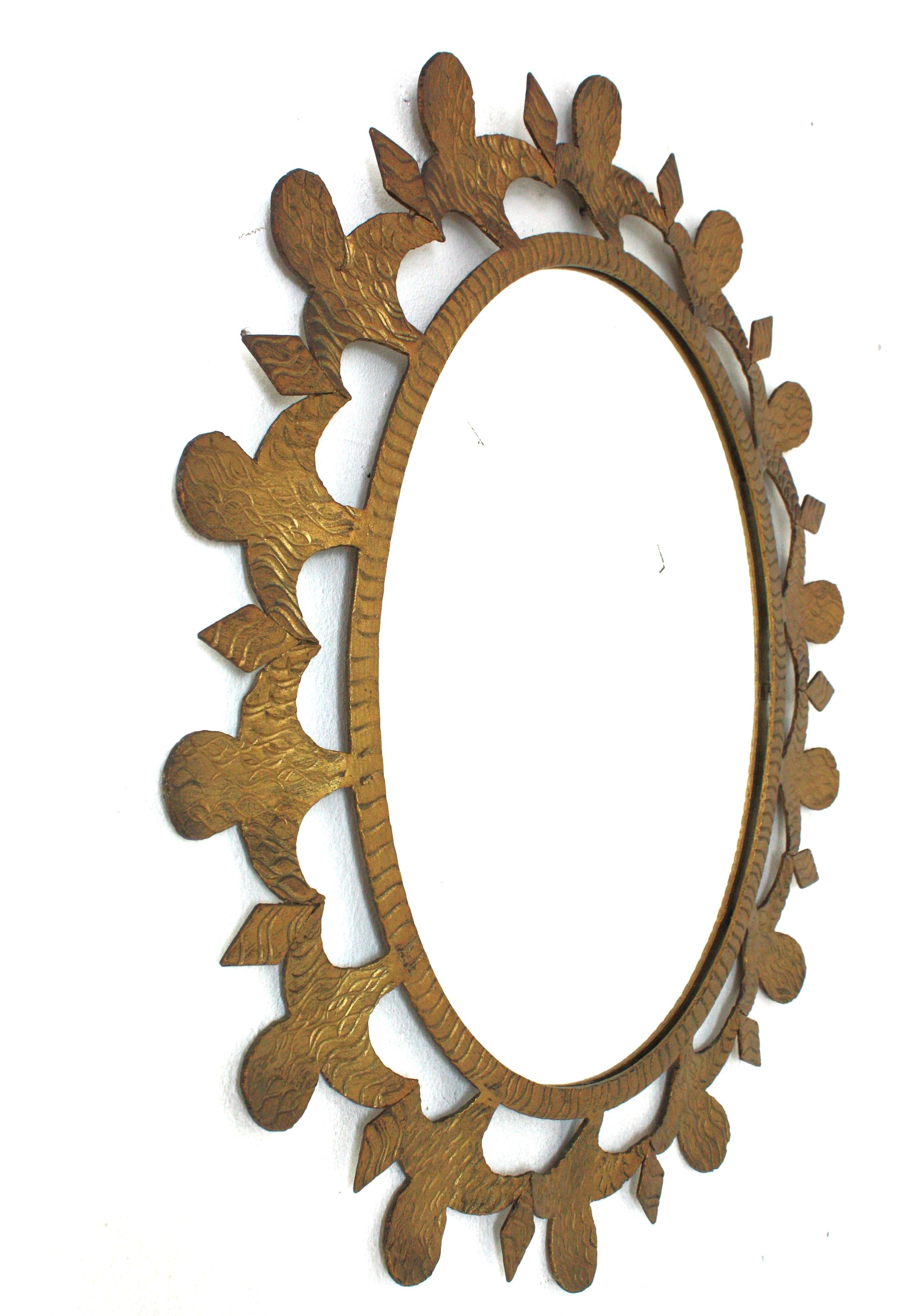 Hand-Crafted Brutalist Sunburst Oval Mirror in Gilt Wrought Iron