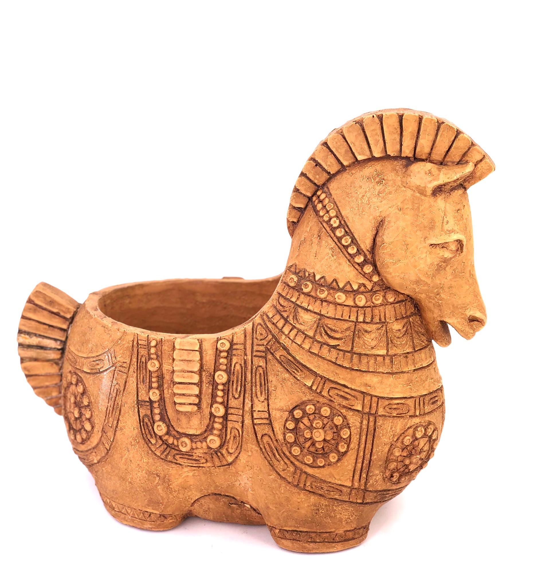 Striking terracotta detailed Trojan style horse sculpture, circa 1970s can be used to put keys matches or a planter well-done piece with some natural finish imperfections.