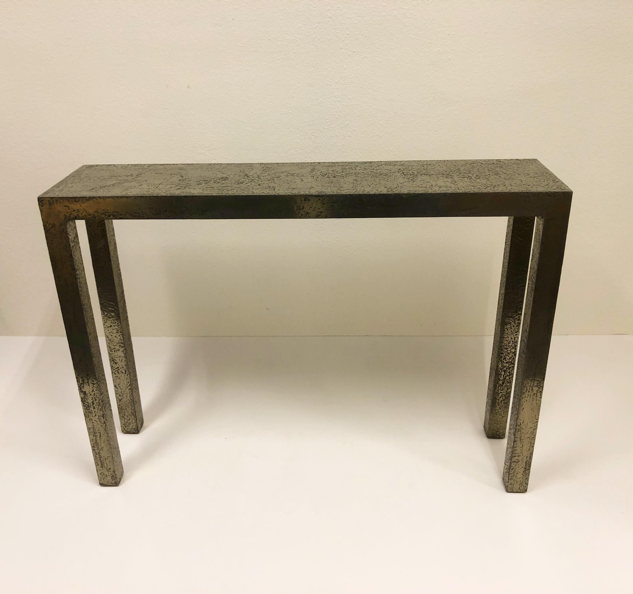 A spectacular 1980s console table with a custom Brutalist silver finish by Lee Marriott interiors. 

Dimension: 12” deep, 48” wide, 34” high.