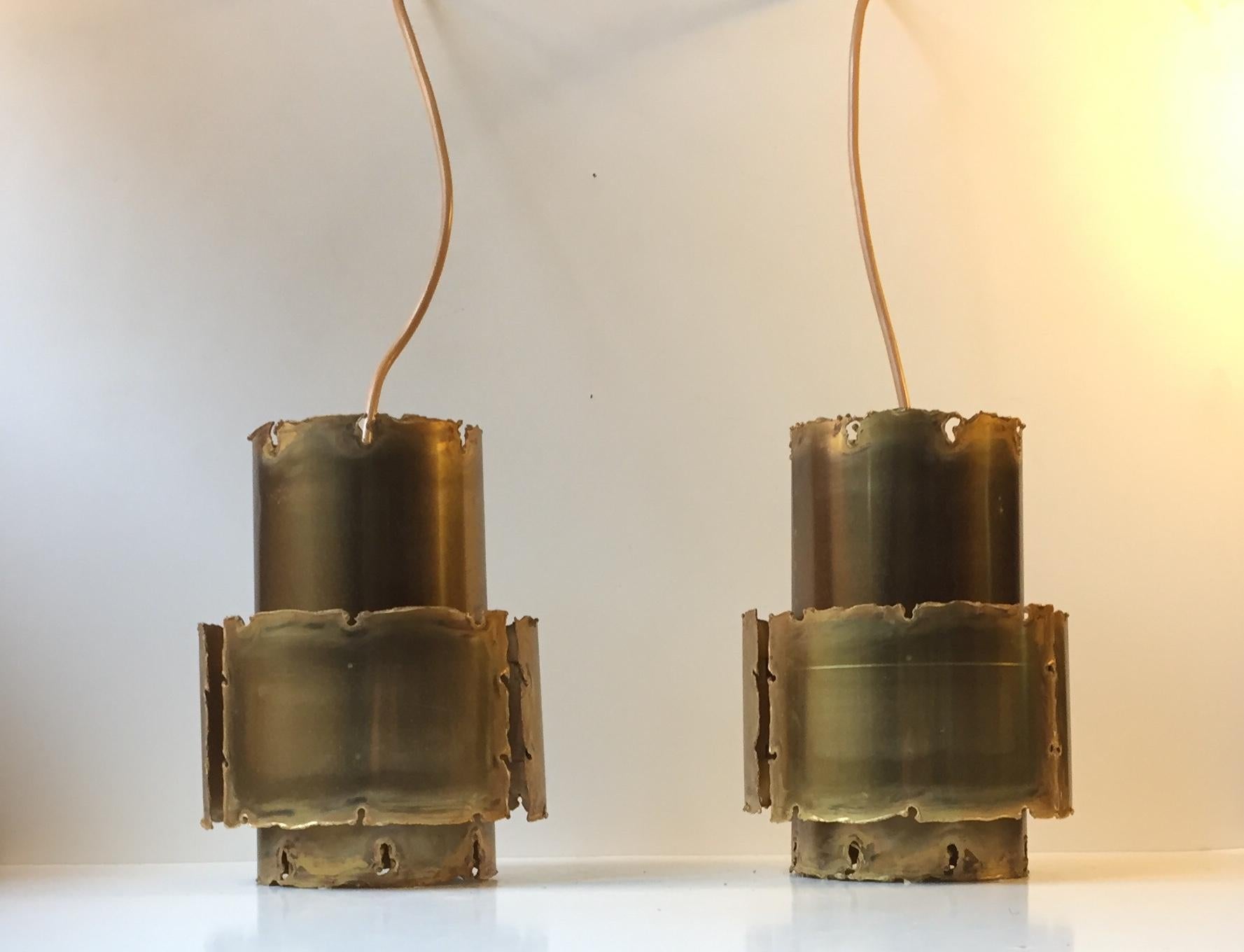 A pair of Brutalist acid treated and torch-cut pendants was designed by Svend Aage Holm Sørensen in the early 1960s. Manufactured by Holm Sørensen in Denmark. The price is for the pair.