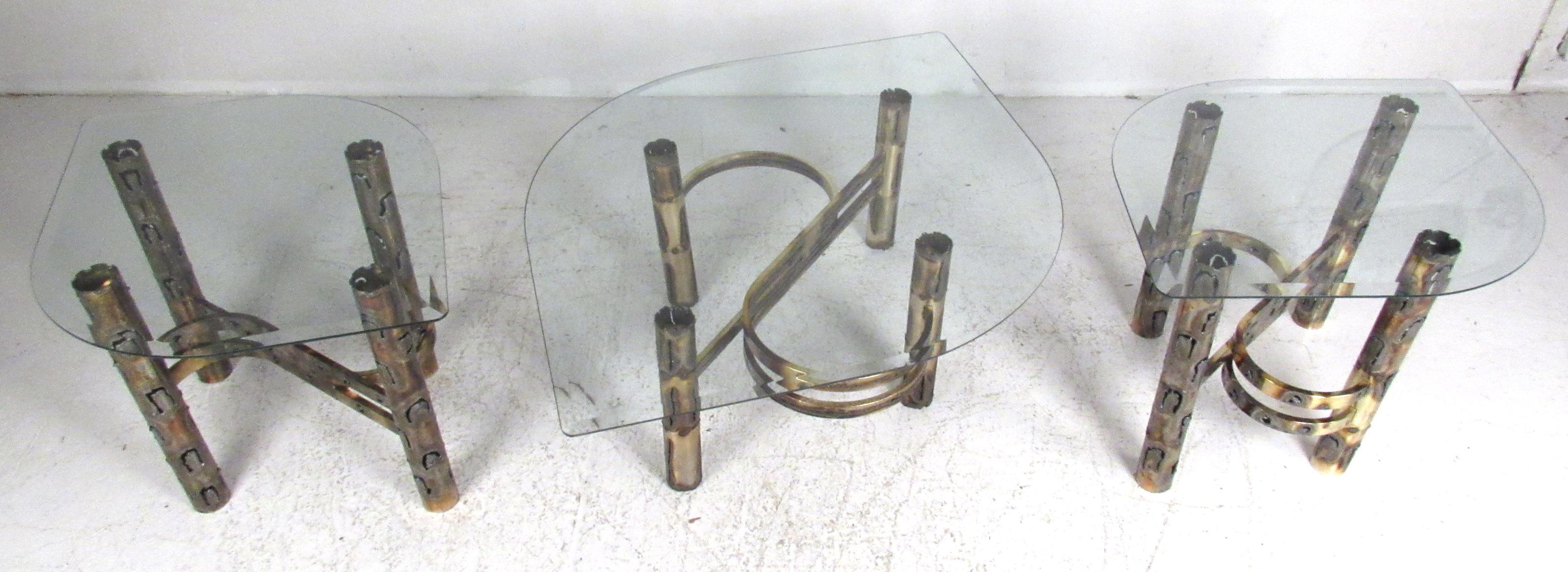 Three piece matching end table or coffee table set with Brutalist style torch cut bases and beveled glass tops. Please confirm item location (NY or NJ).