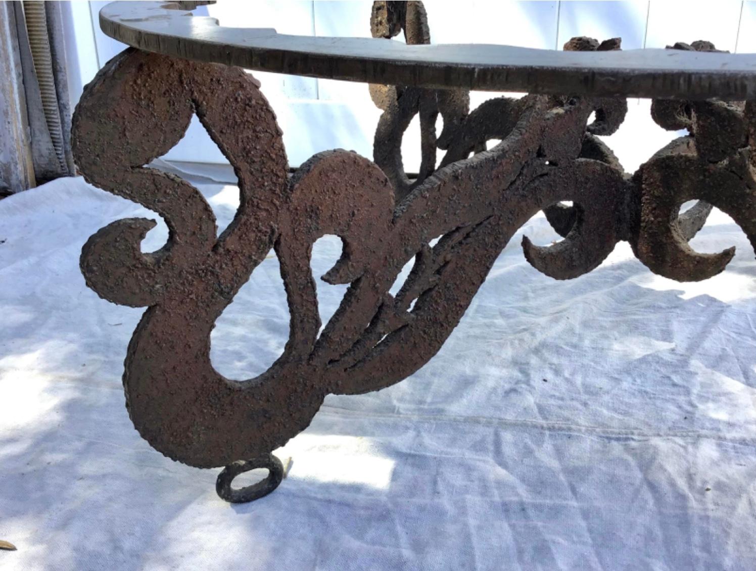 Vintage hand Sculpted Torch cut brutalist metal coffee table. This artistic sculpted iron coffee table base makes for a unique addition to home, art studio or Business. In excellent condition with appropriate wear / patina.