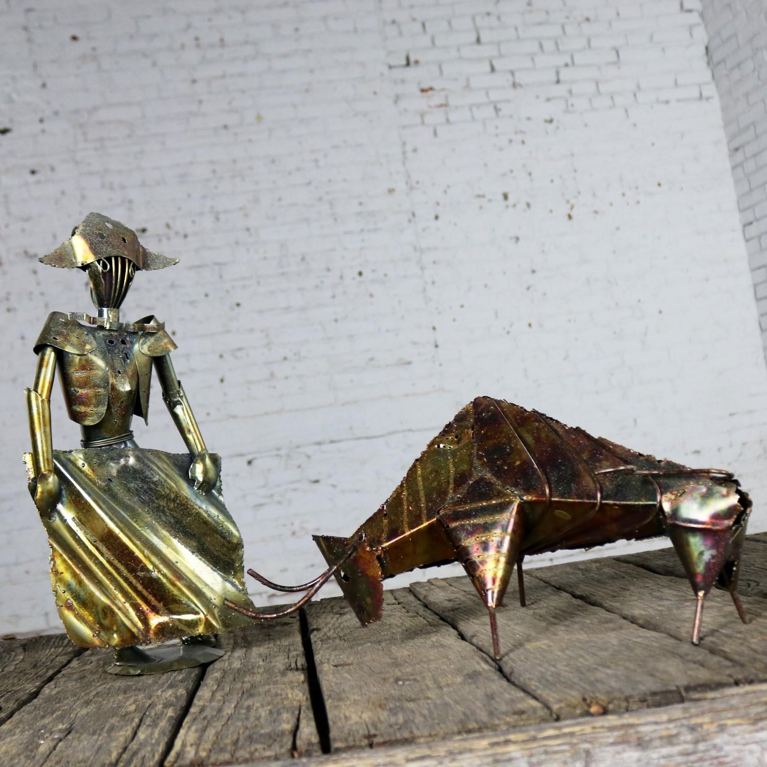Awesome Brutalist Mid-Century Modern torch cut metal bull and matador sculpture. They are in excellent condition with original Made in Hong Kong stickers, circa 1960s-1970s. 

Olé! Toro! Don’t you just love this wonderful pair of Brutalist torch