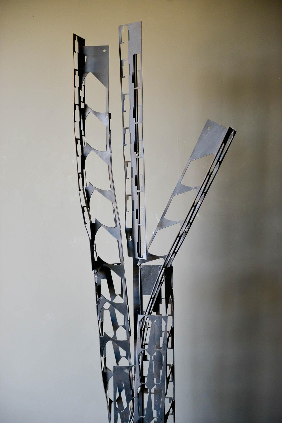 Brutalist torch cut metal floor sculpture, circa 1970. Handcut metal spires on a heavy iron base. Unsigned. 

Measures: 80