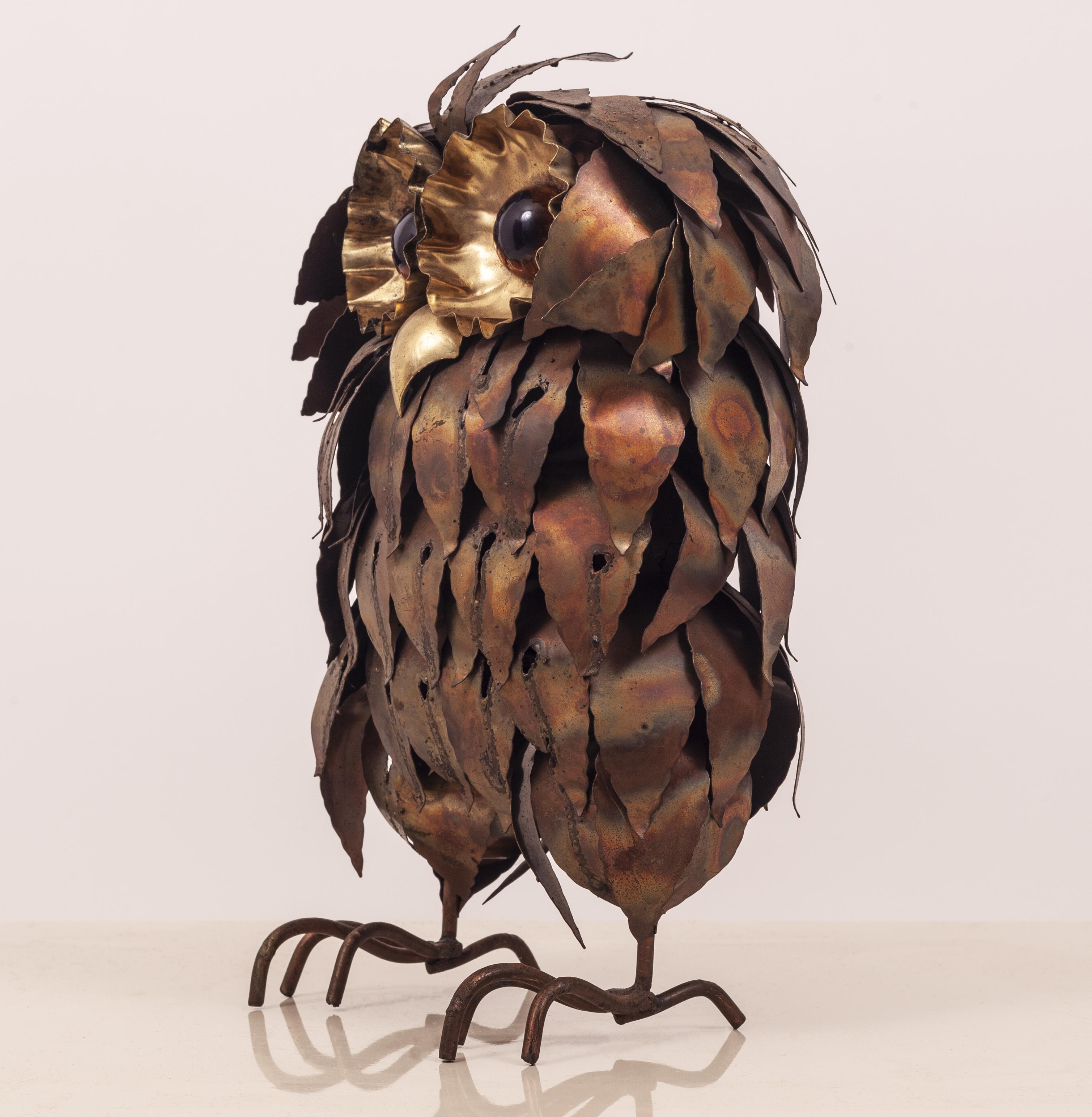 This vintage 1960s patinated, torch cut and burnished brass and copper owl sculpture gazes at you with large resin eyes. 
 It is unsigned. 
 Artfully crafted in the manner of Curtis Jere, this work is exceptionally well executed.