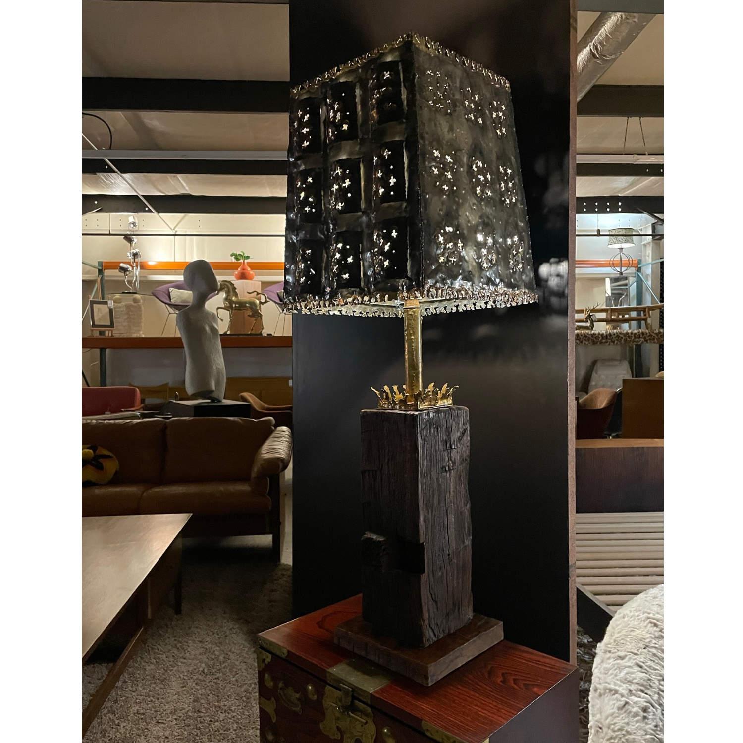 Absolutely stunning mid-century Brutalist table lamp. Body is comprised of a solid block of rough hewn wood. A second block artfully balances within the larger block. Look to the shoulders of the lamp to see a bouquet of ridges that mimic a coral