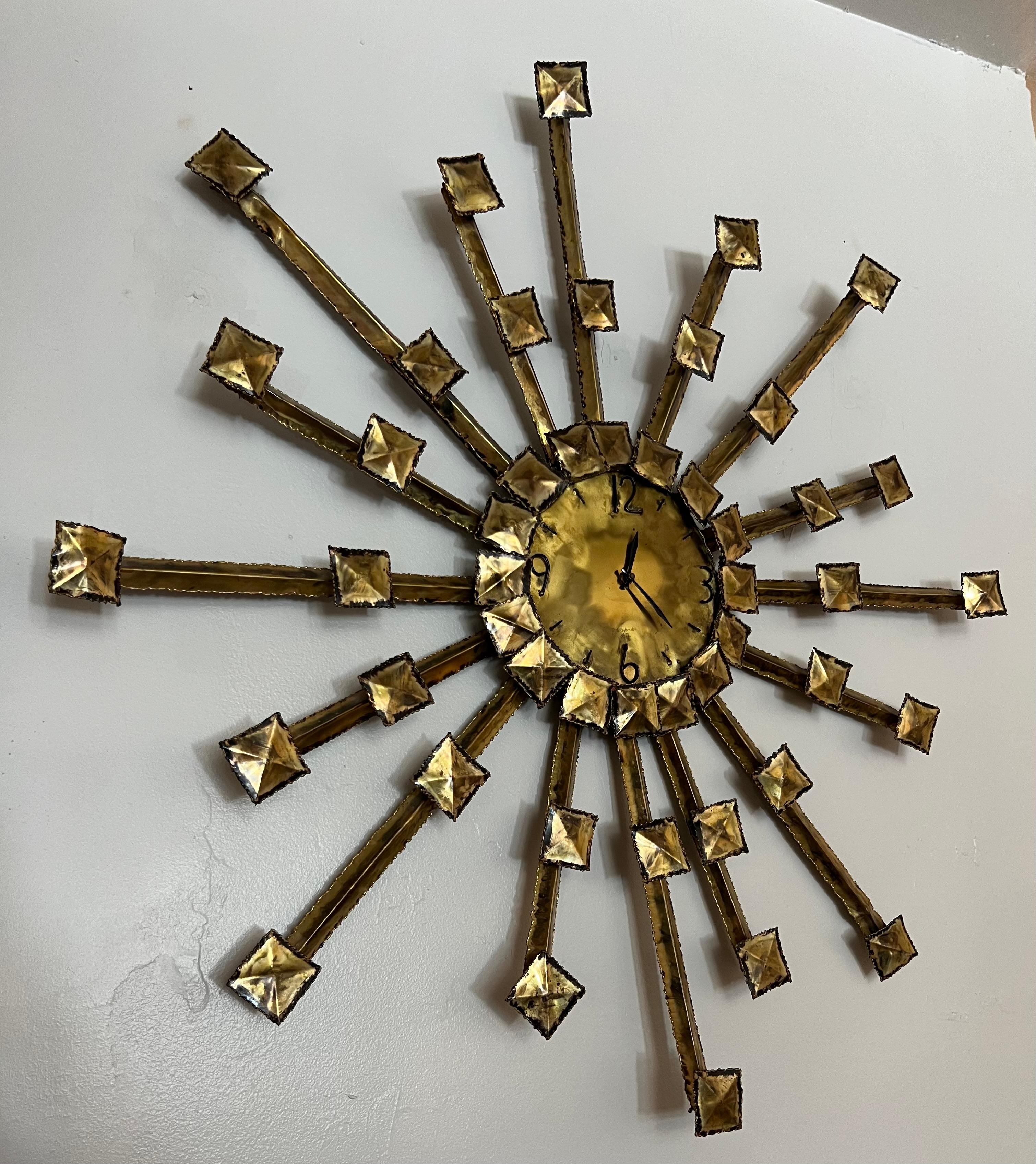 Brutalist torch cut wall clock. Signed J. Alexander 75. Keeps time however the movement is a bit slow and over time falls behind slightly. Beautiful patinated mixed metal componentes throughout. Please refer to photos (additional photos available