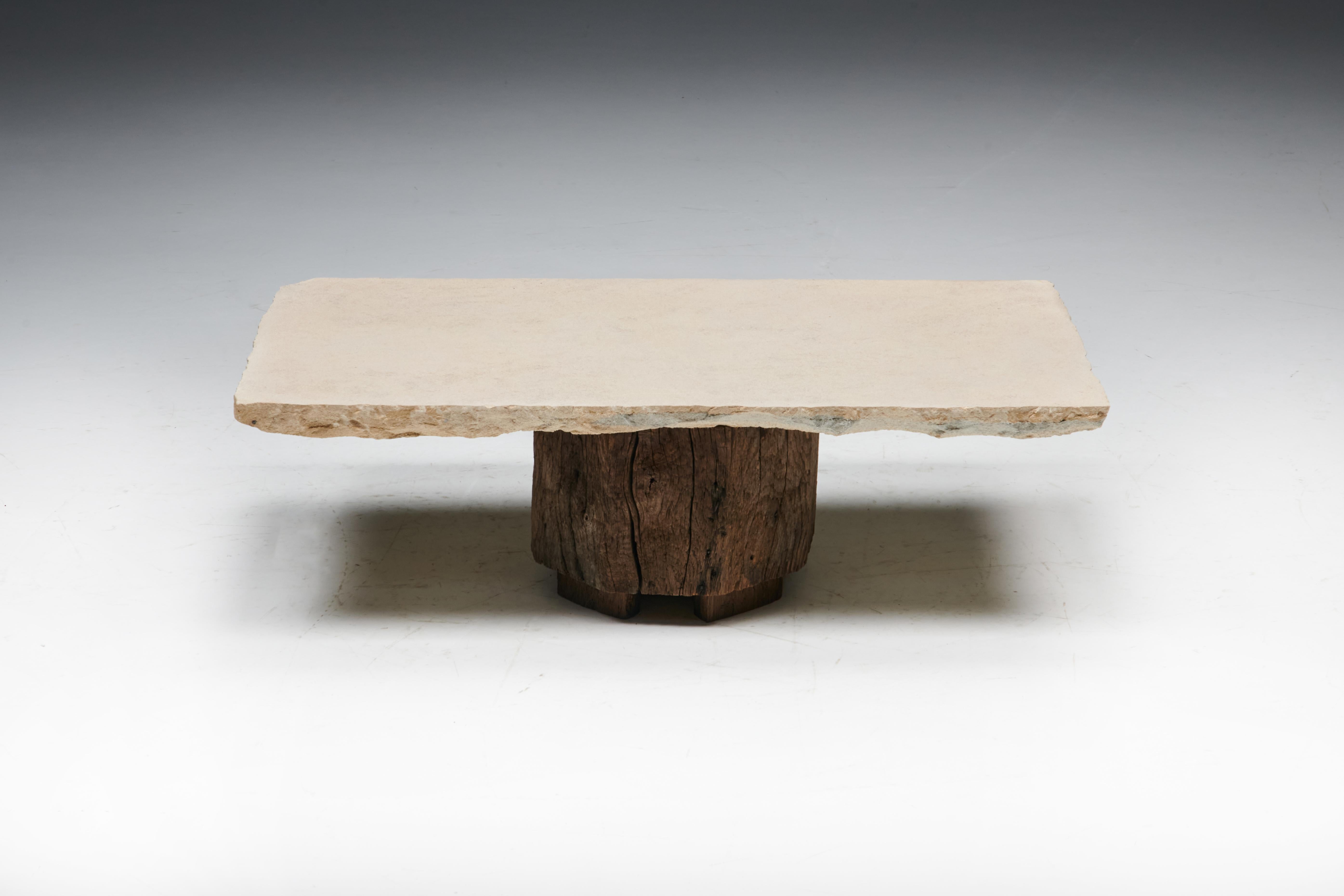 This unique rustic folk art coffee table is handcrafted from a solid tree trunk and finished with exquisite slate as a tabletop, seamlessly blending natural beauty with functional design. We have matching side tables and storage pieces available in