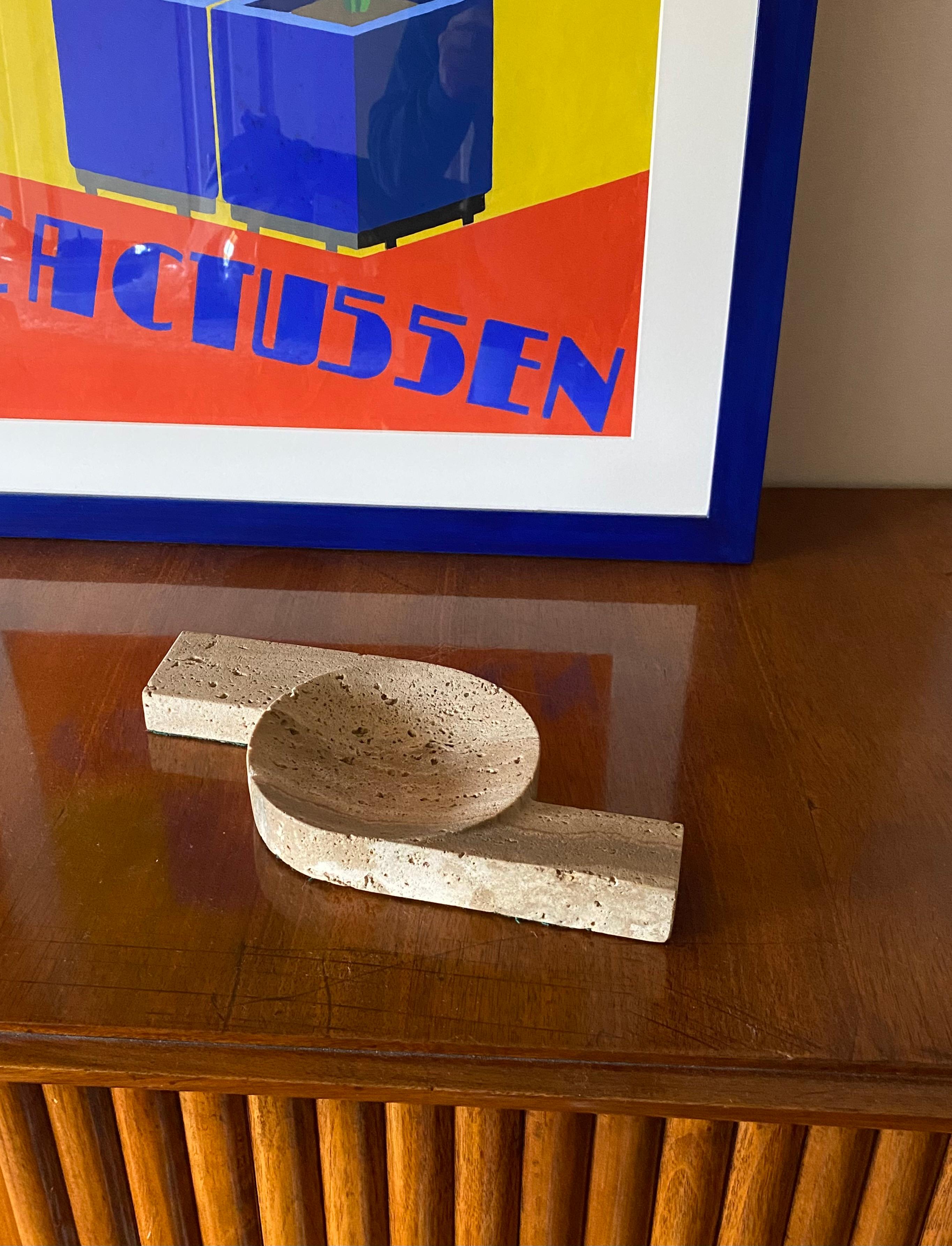 Brutalist travertine ashtray

Manufactured by CN Cerri Nestore, Italy, 1970s.

H 3.5 cm

29 x 14 cm

Conditions: excellent consistent with age and use