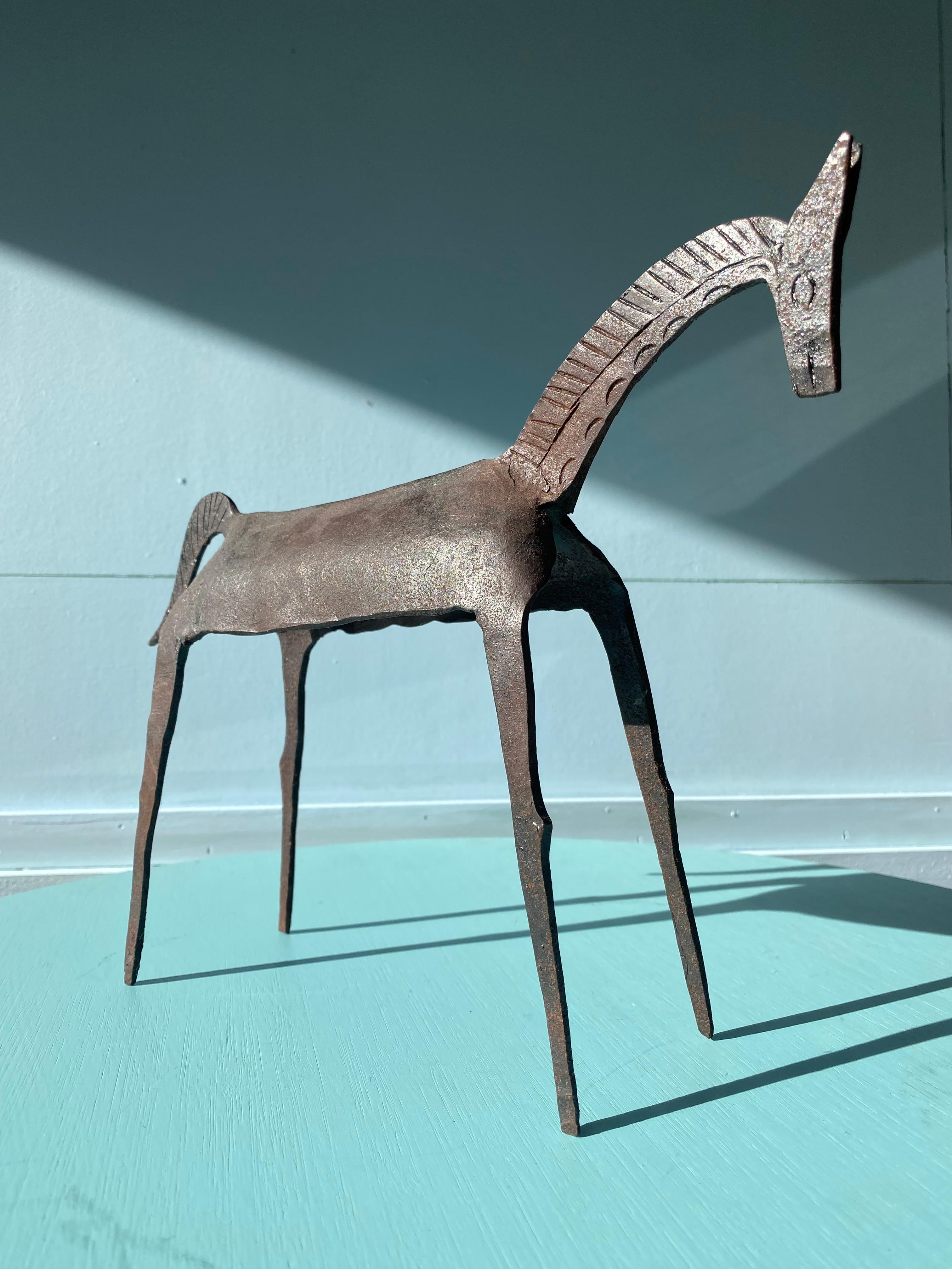 A delightful tribal brutalist sculpture of a horse, showing exceptional character and decorative appeal. This is the second of two separate listings of this figure type.

The origin of these figures is disputed. There are arguments made for this