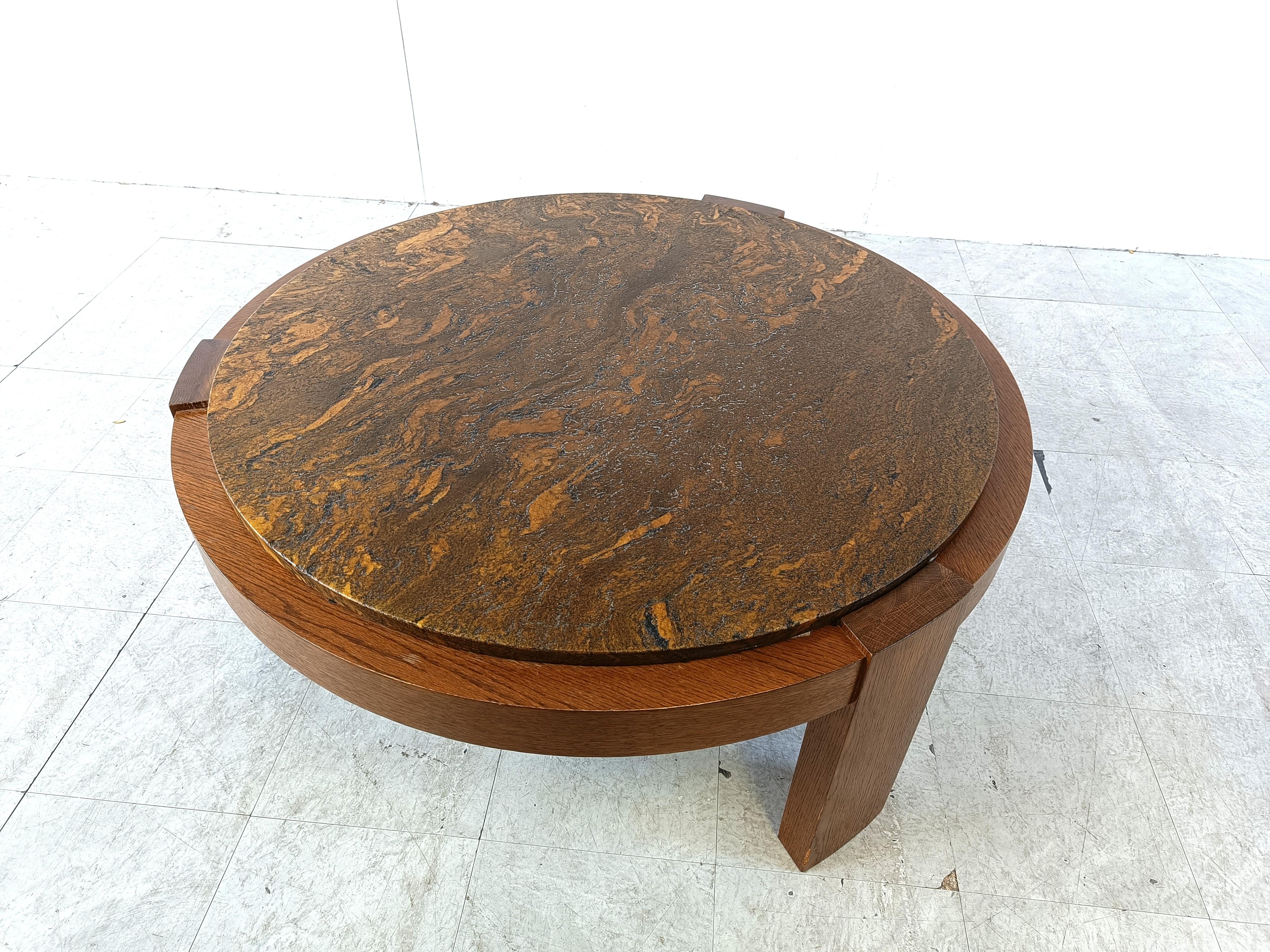 Tripod oak coffee table with a beautiful stone table top.

Rustic coffee table, with a sturdy, simple but attractive oak frame and a beautifully naturally coloured table top.

1970s - Germany

Height: 48cm
Diameter: 110cm

Ref.: 612929