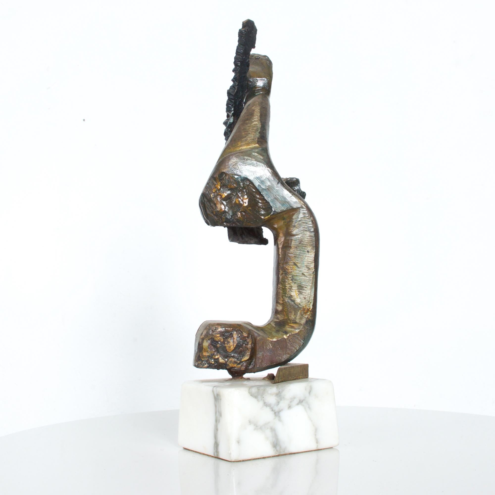 Stunning abstract Brutalist sculpture in patinated iron mounted on contrasting simple white marble base.
In the manner of artist Mathias Goeritz of Mexico.
Dimensions: 16