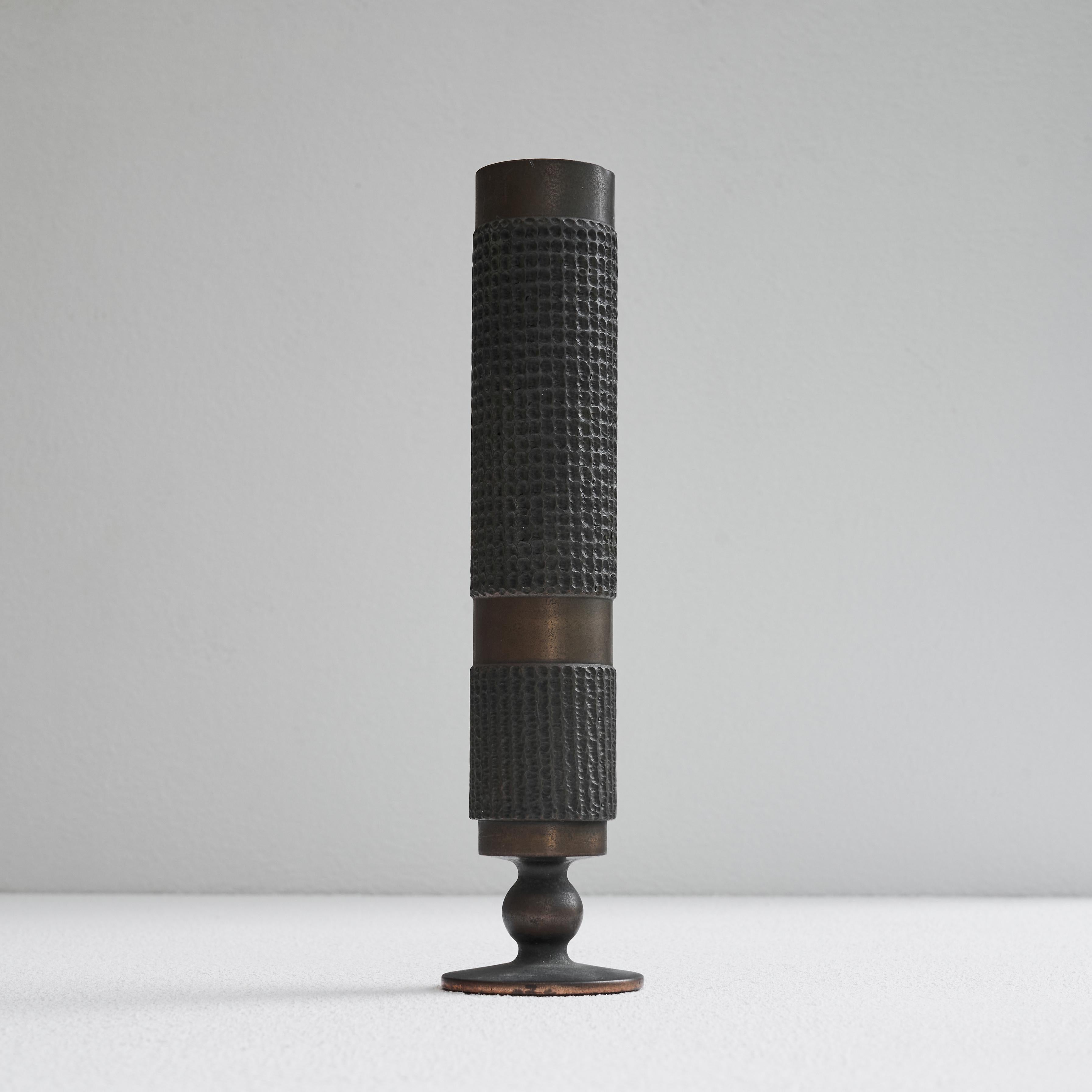 Brutalist Vase in Patinated Brass, 1960s.

This is a wonderful vintage vase in patinated brass with a slender and elegant shape and rough brutalist details. It shows different textures in the brass and has a very well proportioned design which is