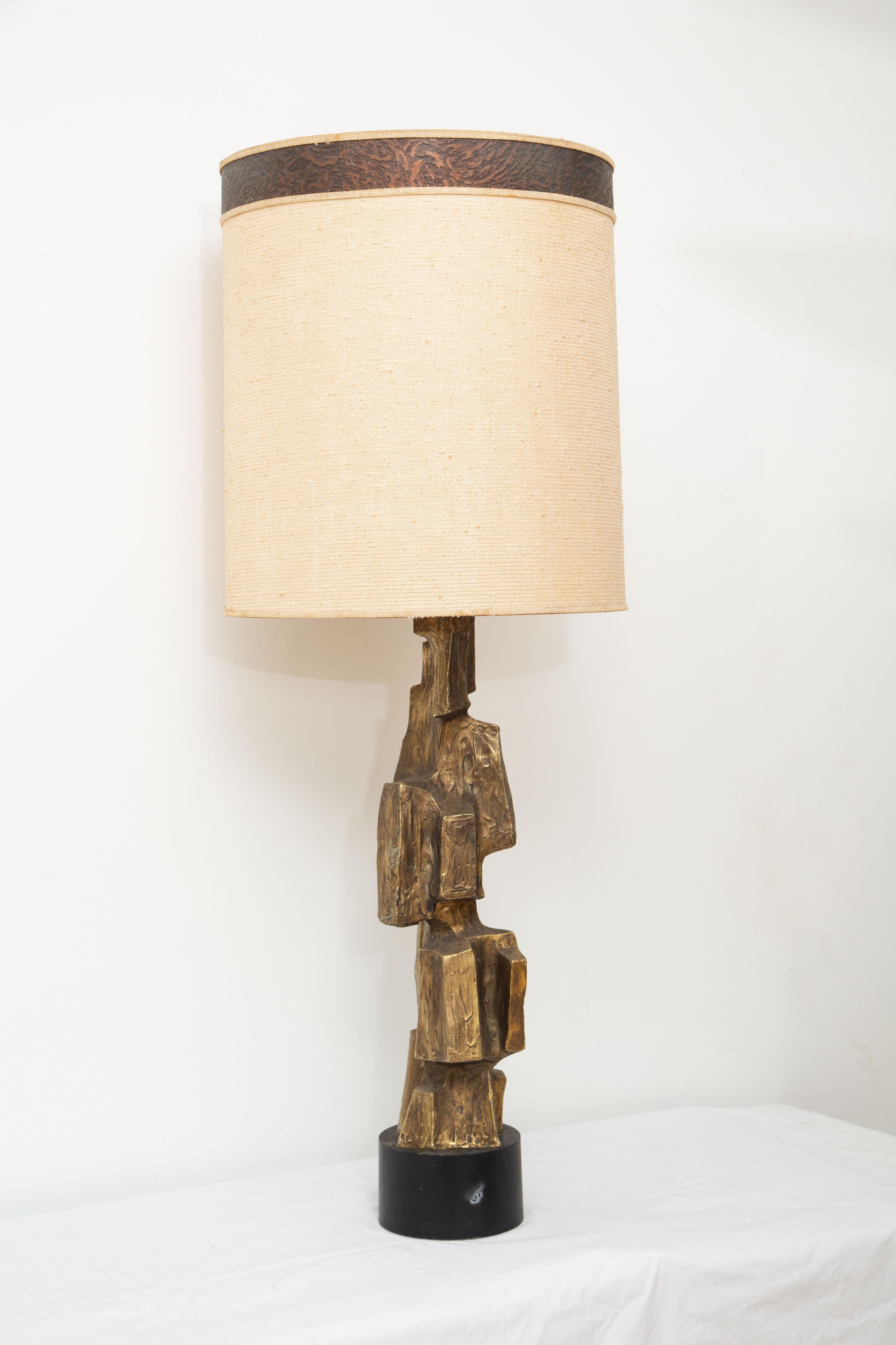 Brutalist vintage table lamp by Tempestini
Large sculptural cast aluminum with bronze patina
Metal base, 
Newly rewired
Original shade shows minor cosmetic wear
Shade: 21