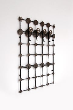 Brutalist wall coat rack with 12 hooks made of metal, 1970