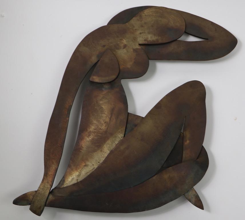 Impressive iron sculpture in the Brutalist style, after Matisse. This wall hanging was made in the 1960s by a Woodstock NY artist ( name unknown ) it is in very good original condition, well executed and heavy. Hangs from a wire connected to two