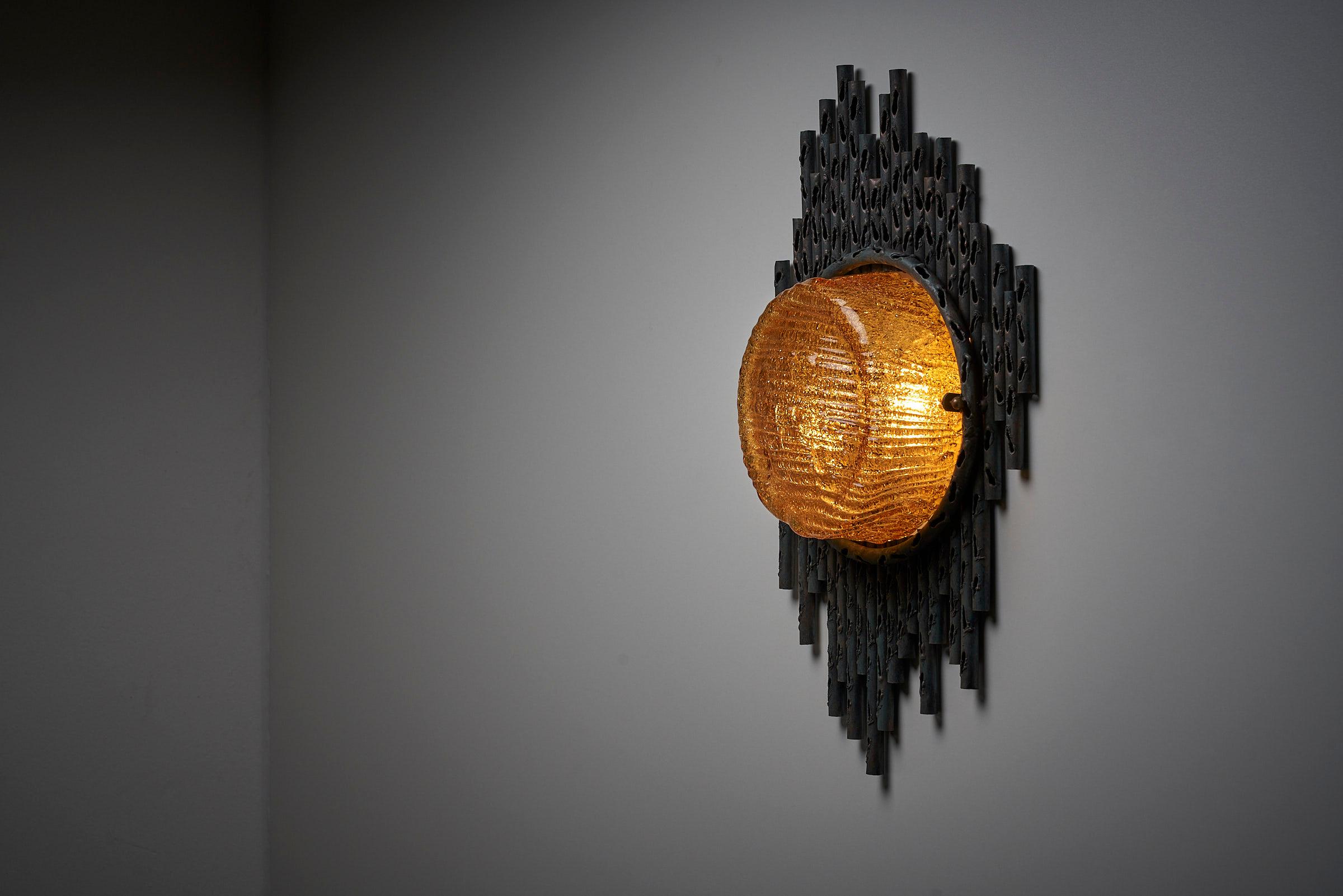 Presenting a mesmerizing piece of Brutalist design, the Brutalist Wall Lamp by Marcello Fantoni from Italy is a true statement of artistic ingenuity. This exceptional wall lamp showcases a harmonious fusion of elements that result in a captivating