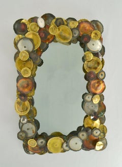 Brutalist Wall Mirror Edged with Metal Circles in the Style of Curtis Jere