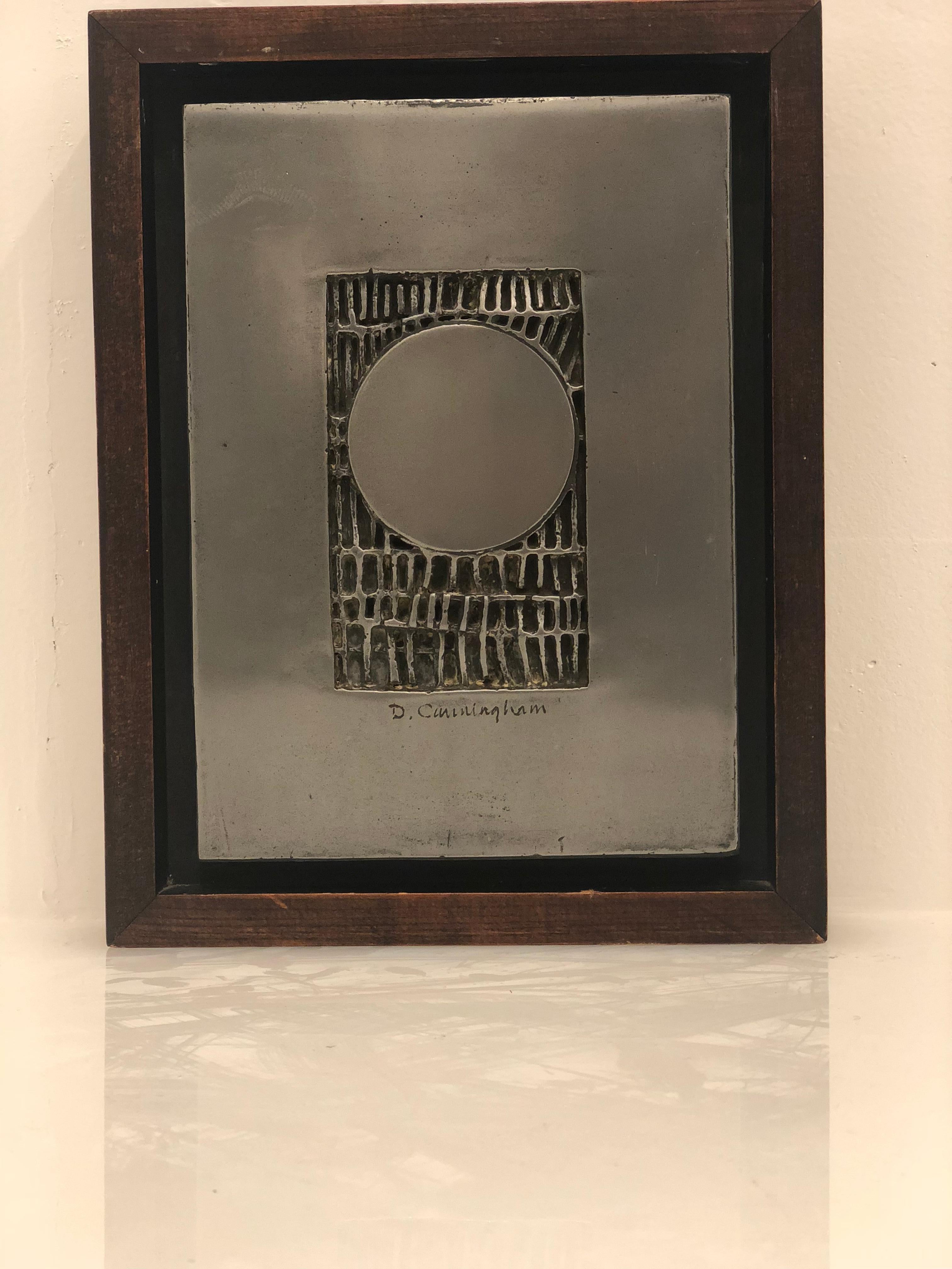 Abstract wall plaque by San Diego artist D Cunningham, cast aluminum on solid walnut stainwood frame, circa 1970s original frame signed on the plaque.