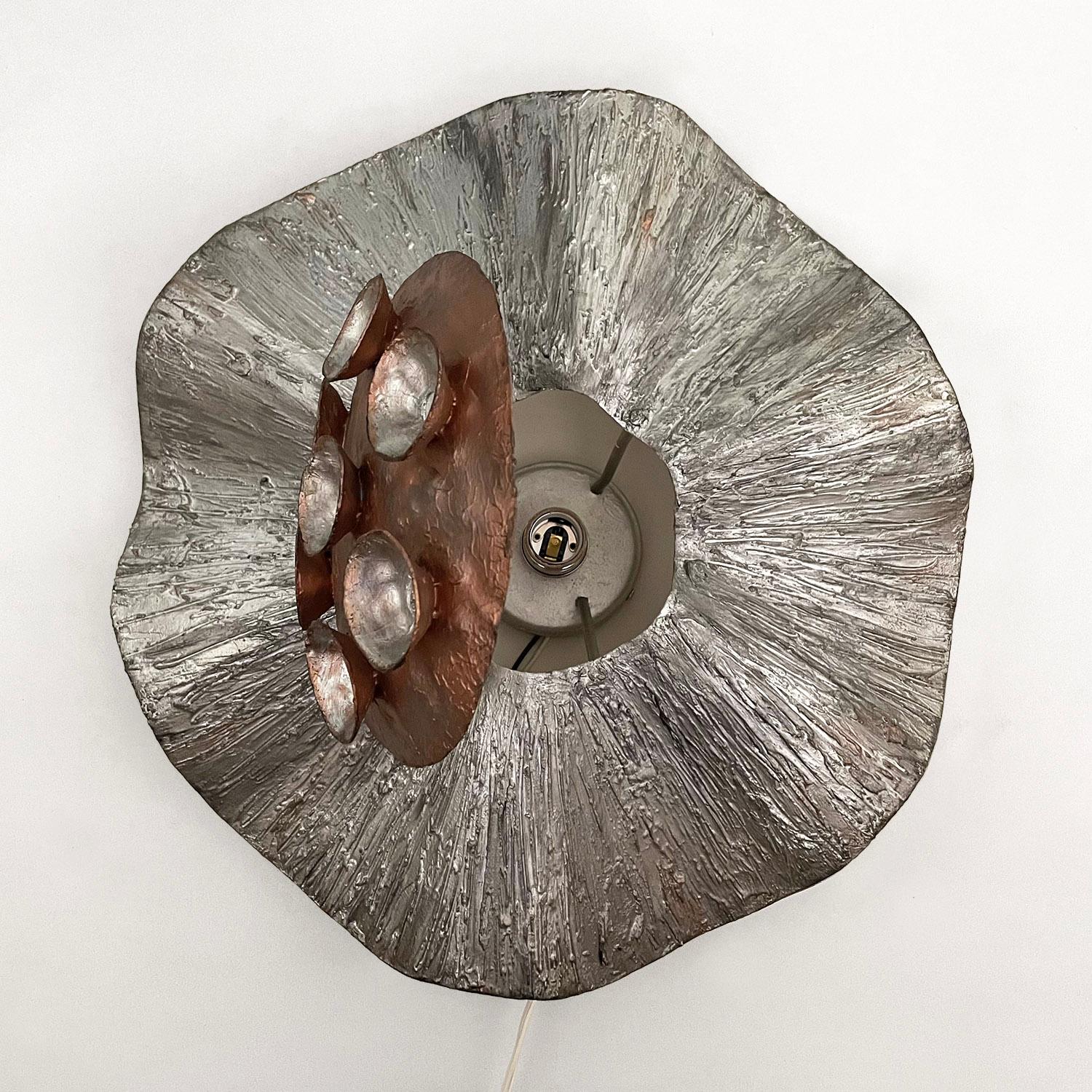 Brutalist wall sconce.
France, circa 1970s.
Organic shape and form.
Wonderful color, texture and patina throughout. 
Newly rewired.
