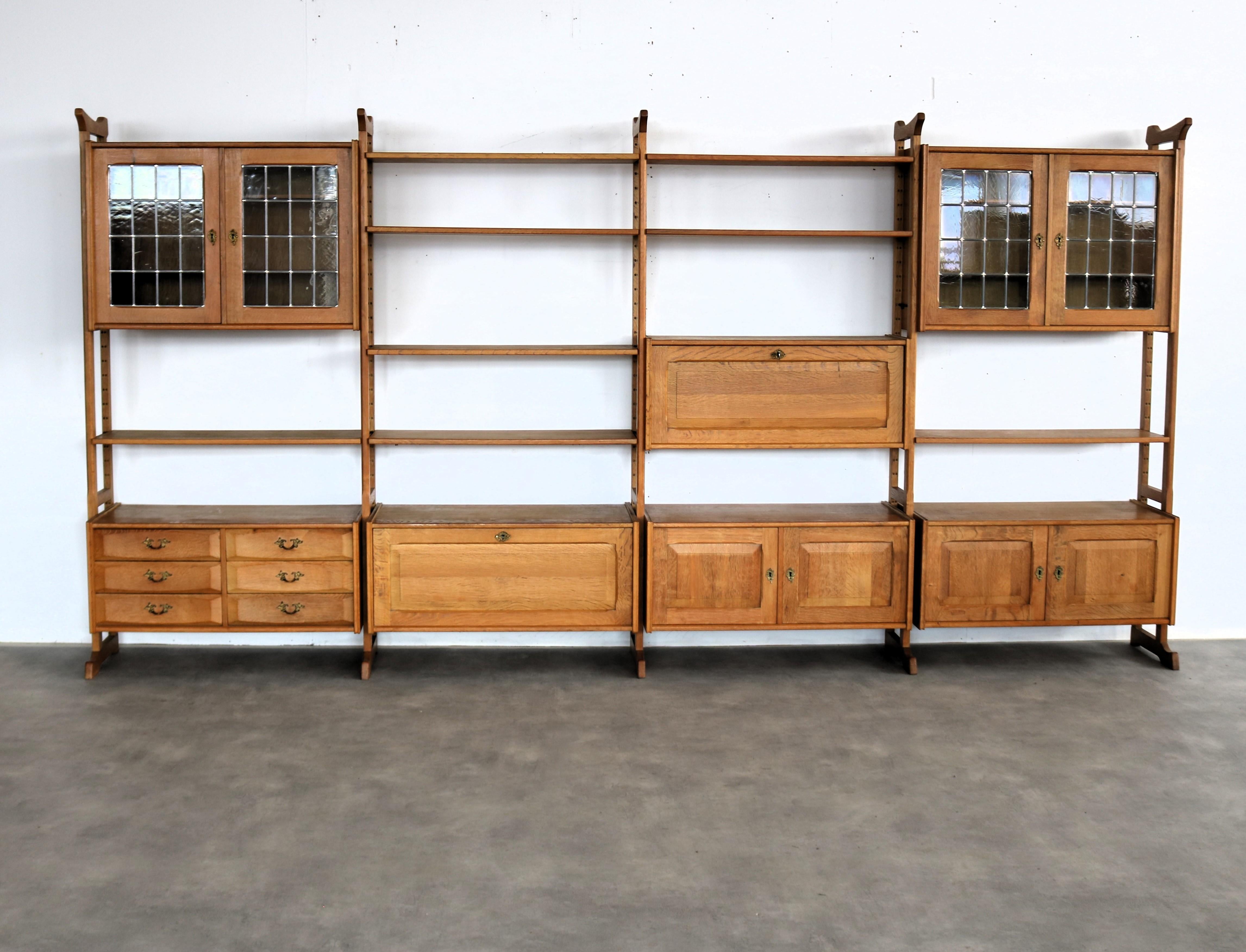 Brutalist wall unit  wall system  1960s  Danish

period  1960s
design  style Henning Kjaernulf  Denmark
condition  good  minor signs of wear
size  189 x 373 x 42.5 (h x w x d)

details  oak; glass; brass; modular;

item number  2928