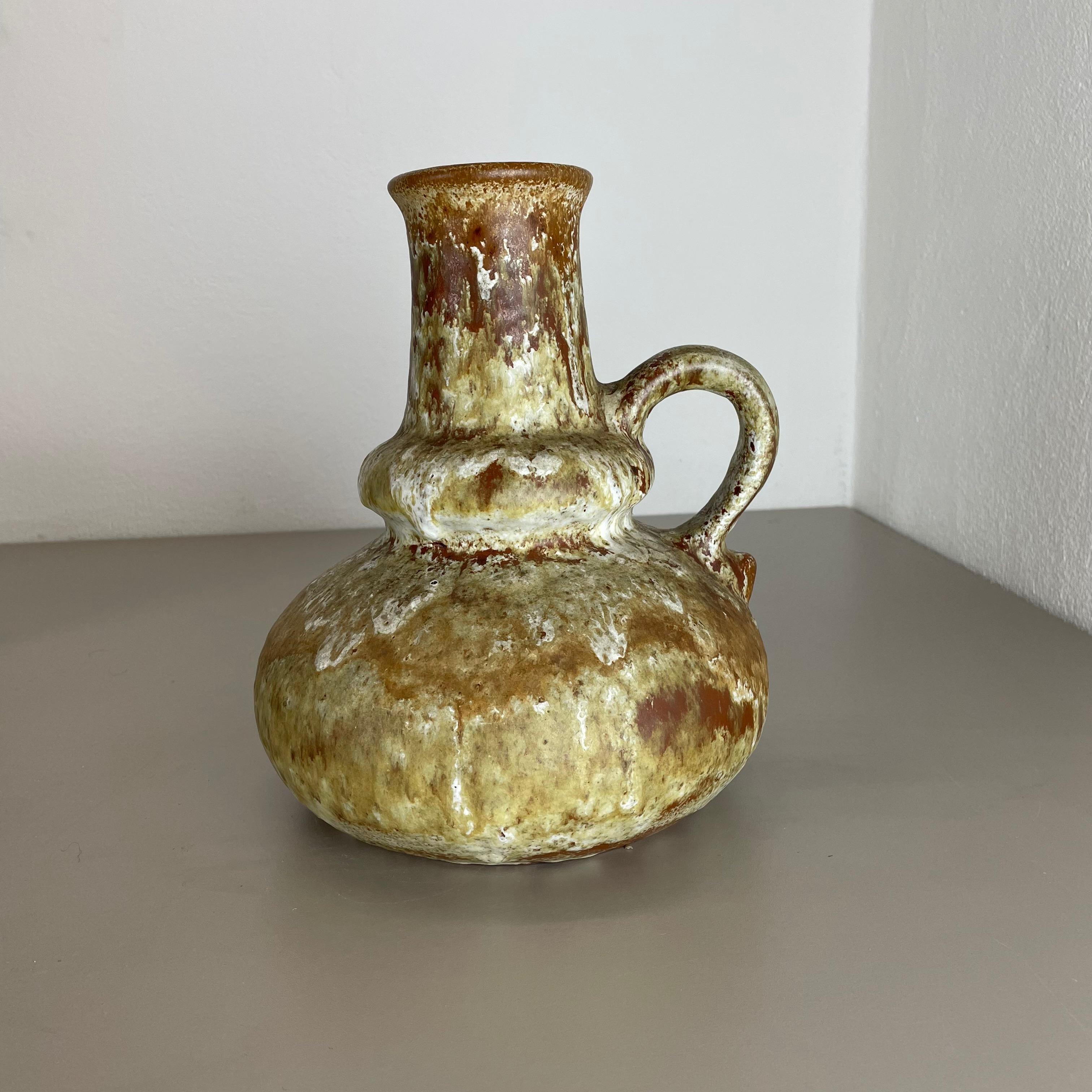 Article:

Fat lava art vase.



Producer:

Ruscha, Germany.



Decade:

1970s.




This original vintage vase was produced in the 1970s in Germany. It is made of ceramic pottery in fat lava optic with abstract illustration in very
